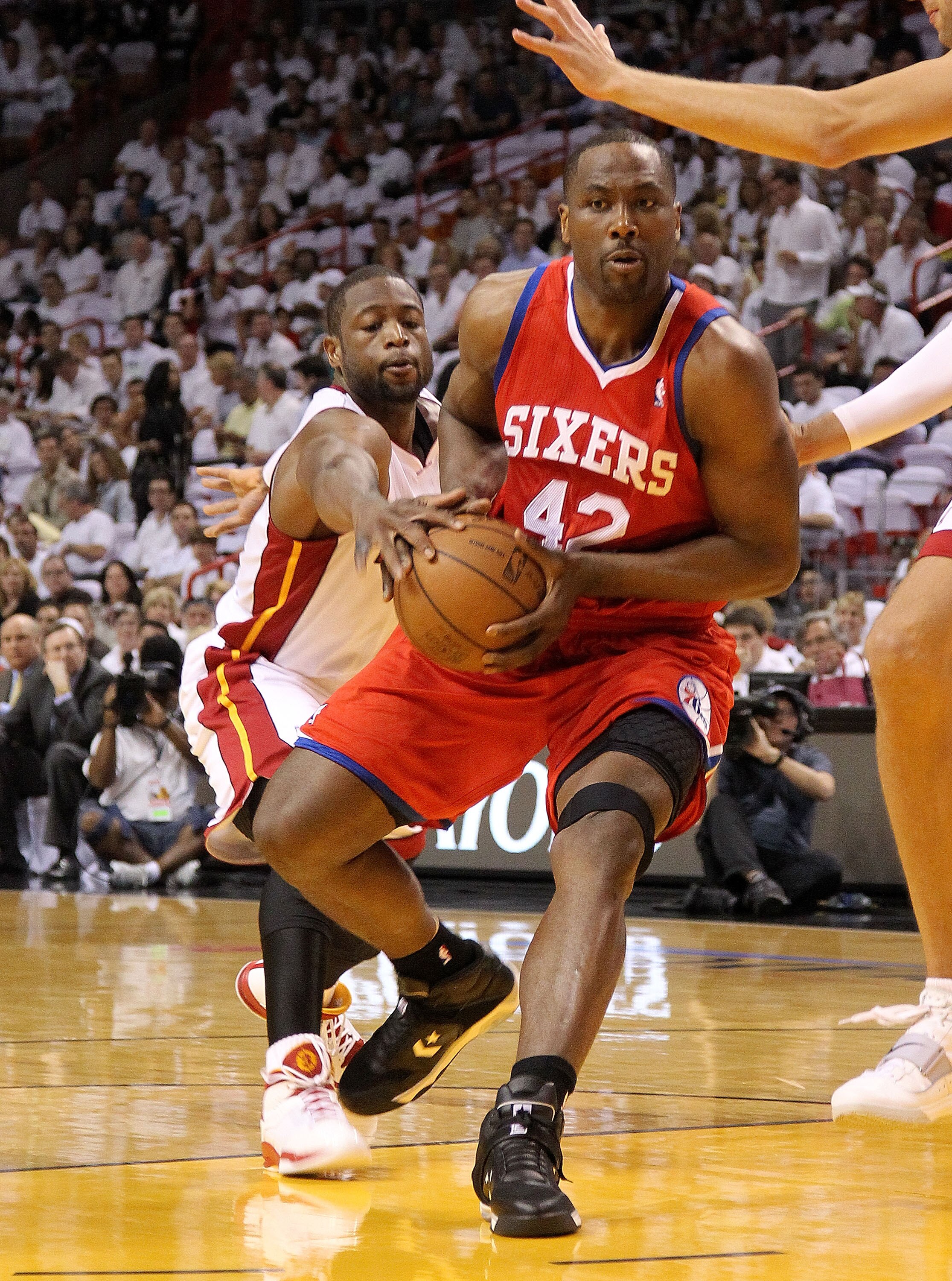 MIAMI, FL - APRIL 27:  Elton Brand #42 of the Philadelphia 76ers drives to the rim past Dwyane Wade #3 of the Miami Heat during game five of the Eastern Conference Quarterfinals in the 2011 NBA Playoffs at American Airlines Arena on April 27, 2011 in Miam