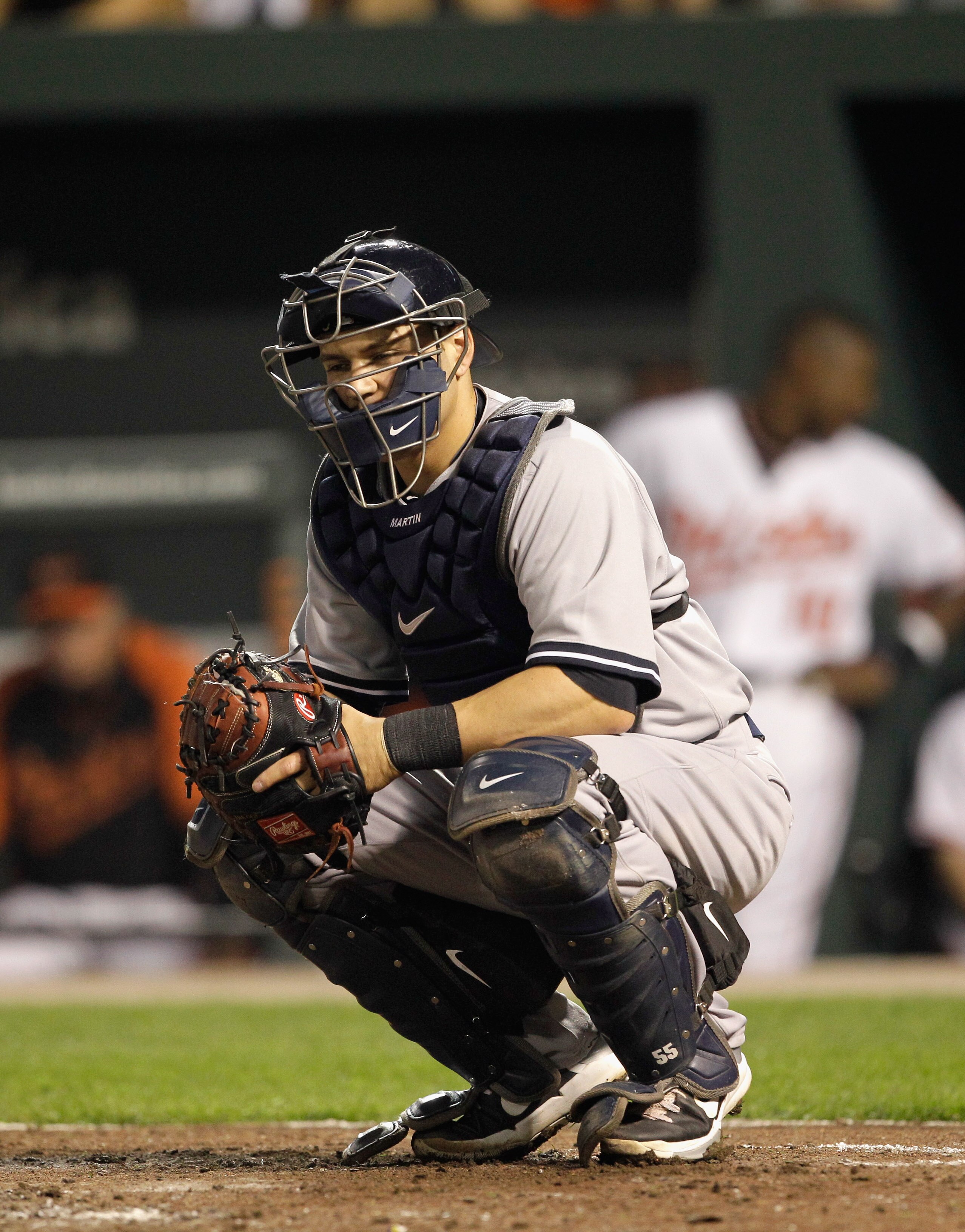 BALTIMORE, MD - APRIL 23:  Catcher Russell Martin #55 of the New York Yankees in action against the Baltimore Orioles at Oriole Park at Camden Yards on April 23, 2011 in Baltimore, Maryland.  (Photo by Rob Carr/Getty Images)