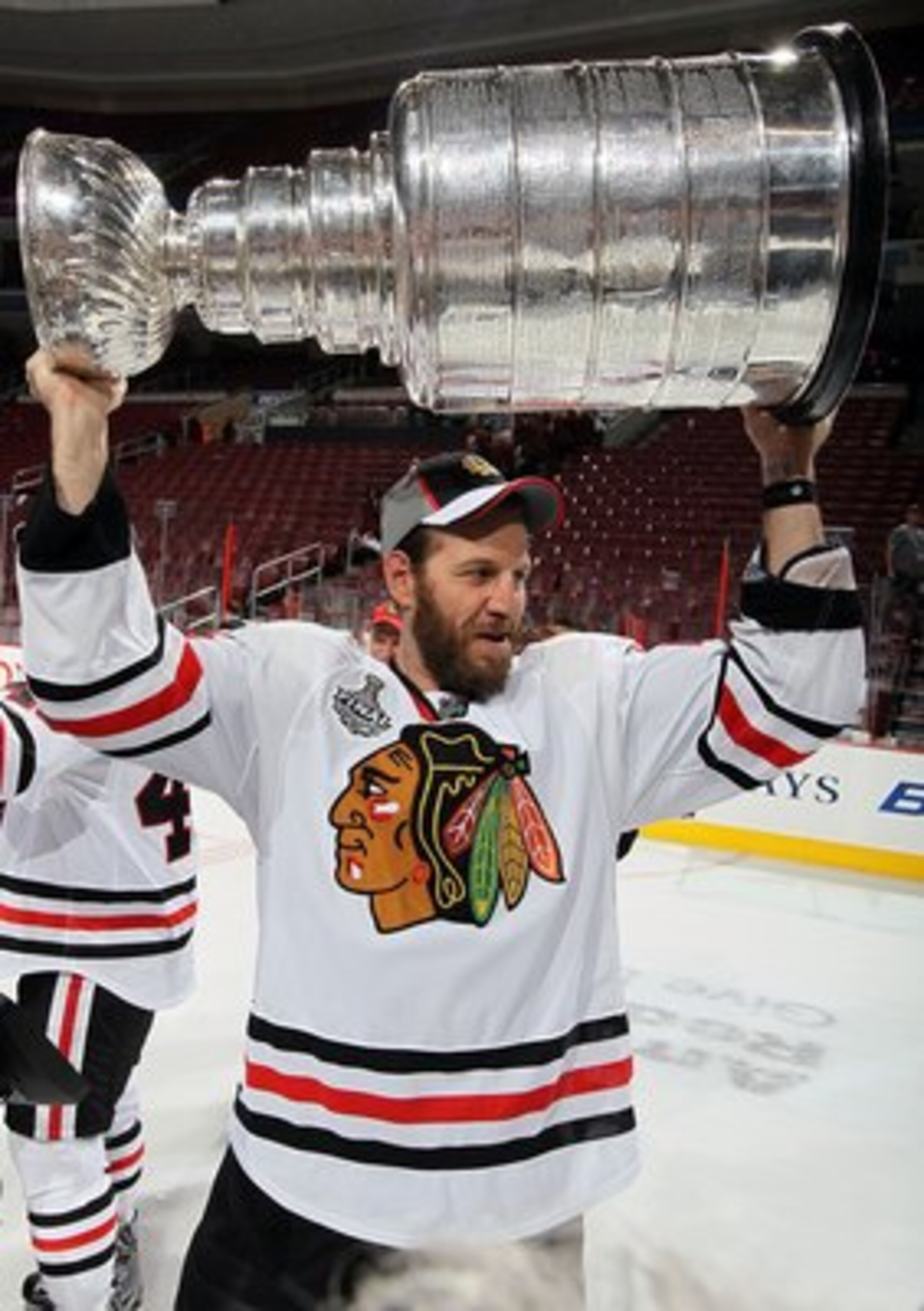 PHILADELPHIA - JUNE 09:  Nick Boynton #24 of the Chicago Blackhawks hoists the Stanley Cup after teammate Patrick Kane scored the game-winning goal in overtime to defeat the Philadelphia Flyers 4-3 and win the Stanley Cup in Game Six of the 2010 NHL Stanl