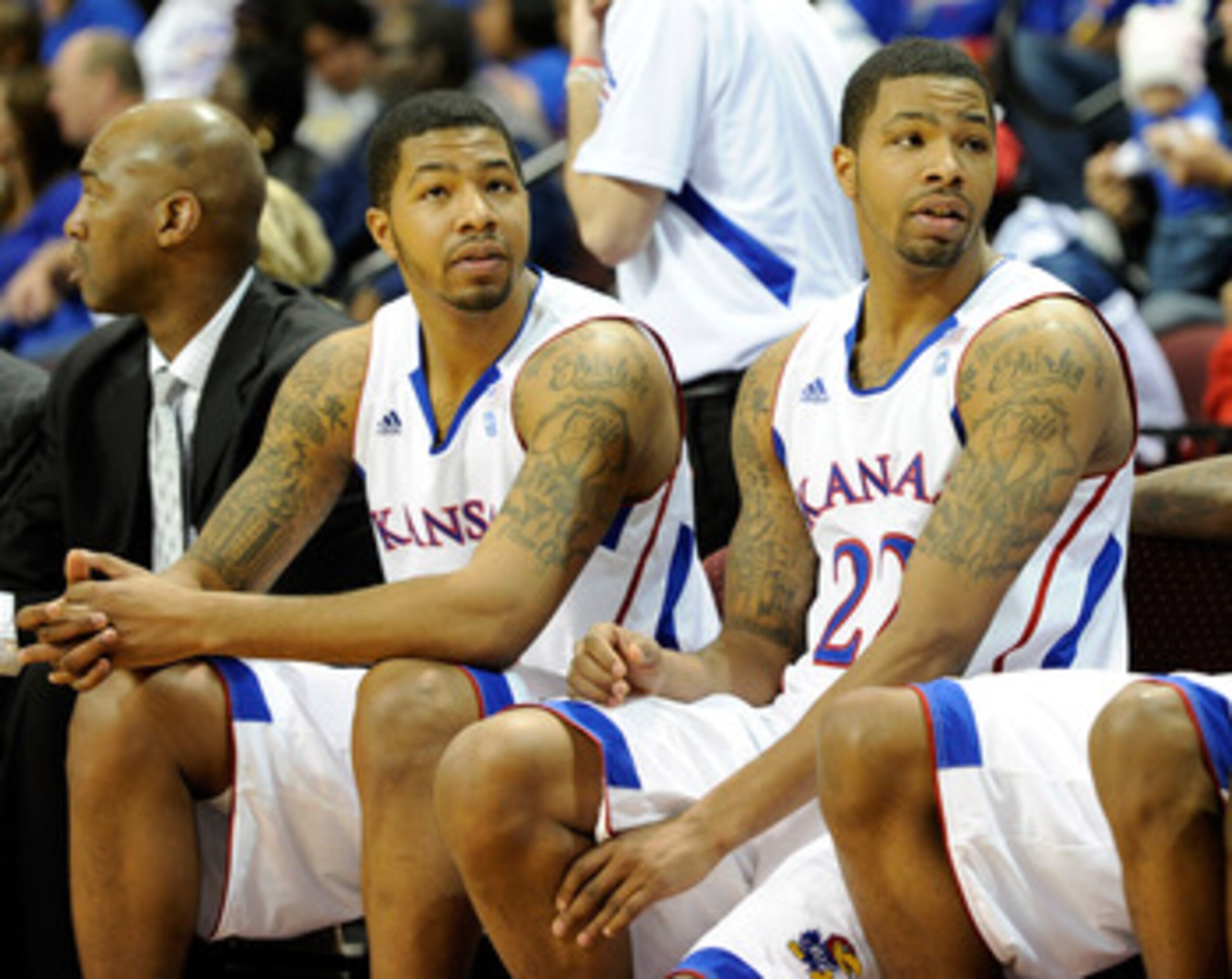 LAS VEGAS - NOVEMBER 26: Markieff Morris (L) #21 and his twin brother Marcus Morris #22 of the Kansas Jayhawks appear on the bench late in the team's 98-41 victory over the Ohio Bobcats during the third round of the Las Vegas Invitational at The Orleans LAS VEGAS - NOVEMBER 26: Markieff Morris (L) #21 and his twin brother Marcus Morris #22 of the Kansas Jayhawks appear on the bench late in the team's 98-41 victory over the Ohio Bobcats during the third round of the Las Vegas Invitational at The Orleans