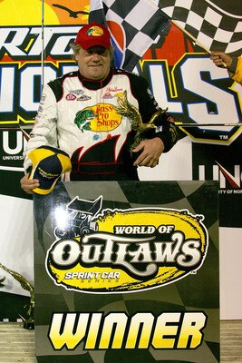 BARBERVILLE, FL - FEBRUARY 07:  20-time World of Outlaws champion Steve Kinser, driver of the #11 Bass Pro Shops, celebrates after winning the World of Outlaws 39th Annual DIRTcar Nationals by UNOH at Volusia Speedway Park on February 7, 2010 in Daytona B