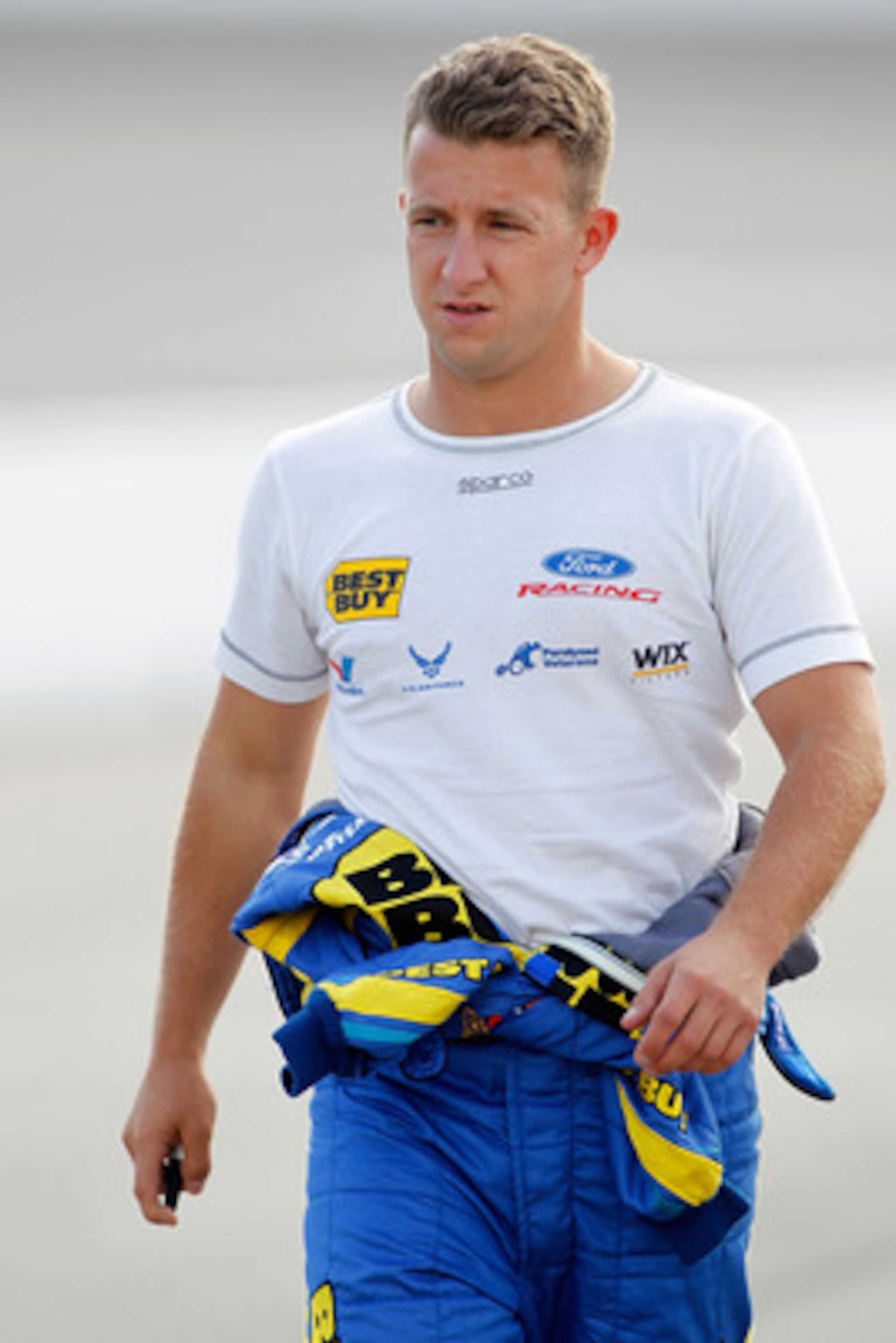 RICHMOND, VA - APRIL 29:  A.J. Allmendinger, driver of the #43 Nautica Ford, walks on pit road during qualifying for the NASCAR Sprint Cup Series Crown Royal Presents The Matthew & Daniel Hansen 400 at Richmond International Raceway on April 29, 2011 in R