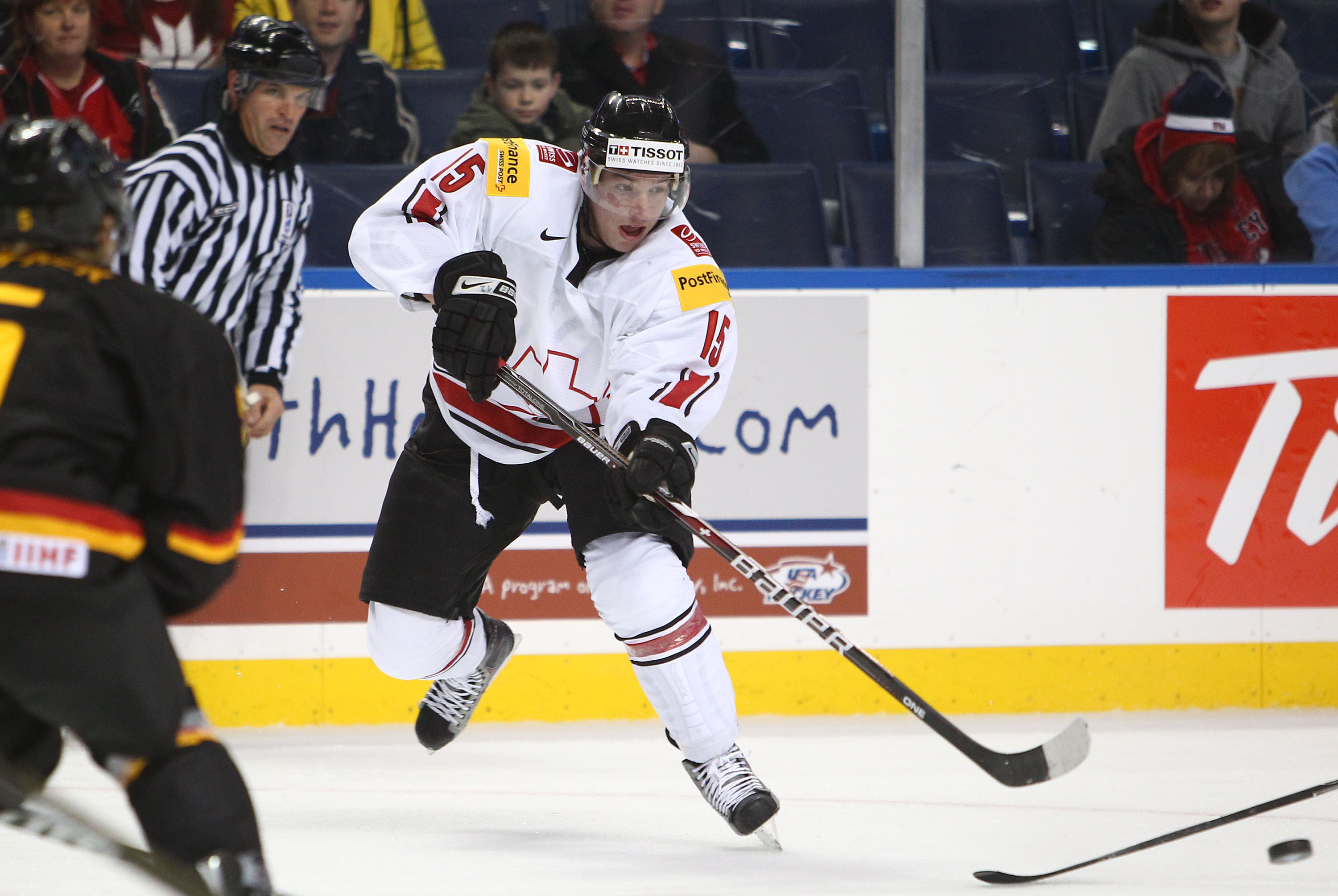 BUFFALO, NY - DECEMBER 26:  Sven Bartschi #15 of Switzerland passes the puck during the 2011 IIHF World U20 Championship Group A game between Germany and Switzerland on December 26, 2010 at HSBC Arena in Buffalo, New York. (Photo by Tom Szczerbowski/Getty