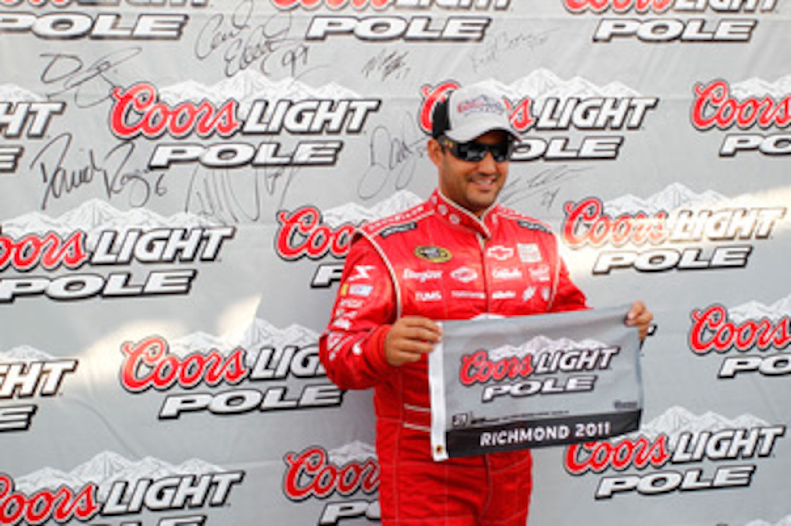 RICHMOND, VA - APRIL 29:  Juan Pablo Montoya, driver of the #42 Target Chevrolet, poses after setting the pole position during qualifying for the NASCAR Sprint Cup Series Crown Royal Presents The Matthew & Daniel Hansen 400 at Richmond International Racew