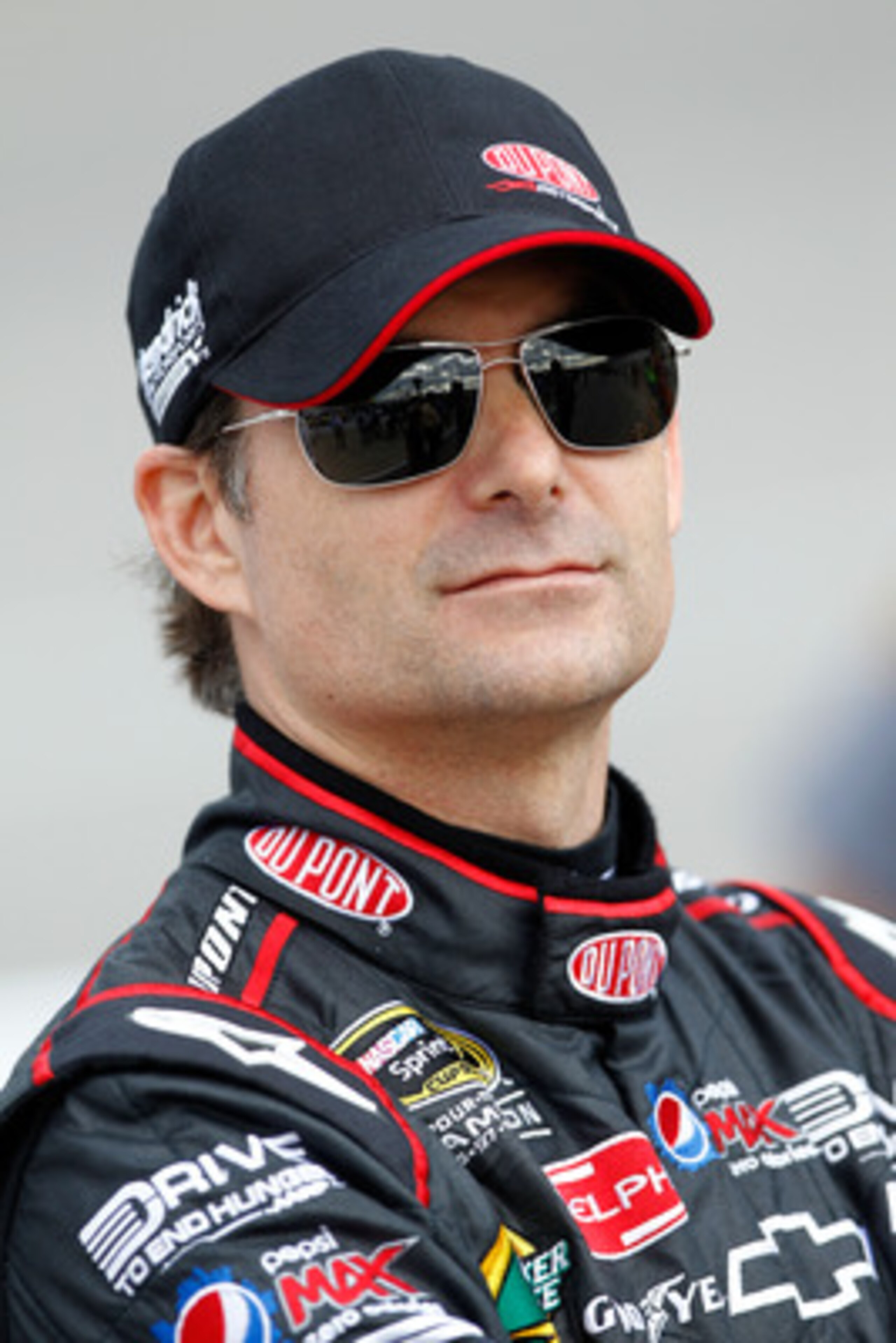 RICHMOND, VA - APRIL 29:  Jeff Gordon, driver of the #24 DuPont Chevrolet, stands on pit road during qualifying for the NASCAR Sprint Cup Series Crown Royal Presents The Matthew & Daniel Hansen 400 at Richmond International Raceway on April 29, 2011 in Ri