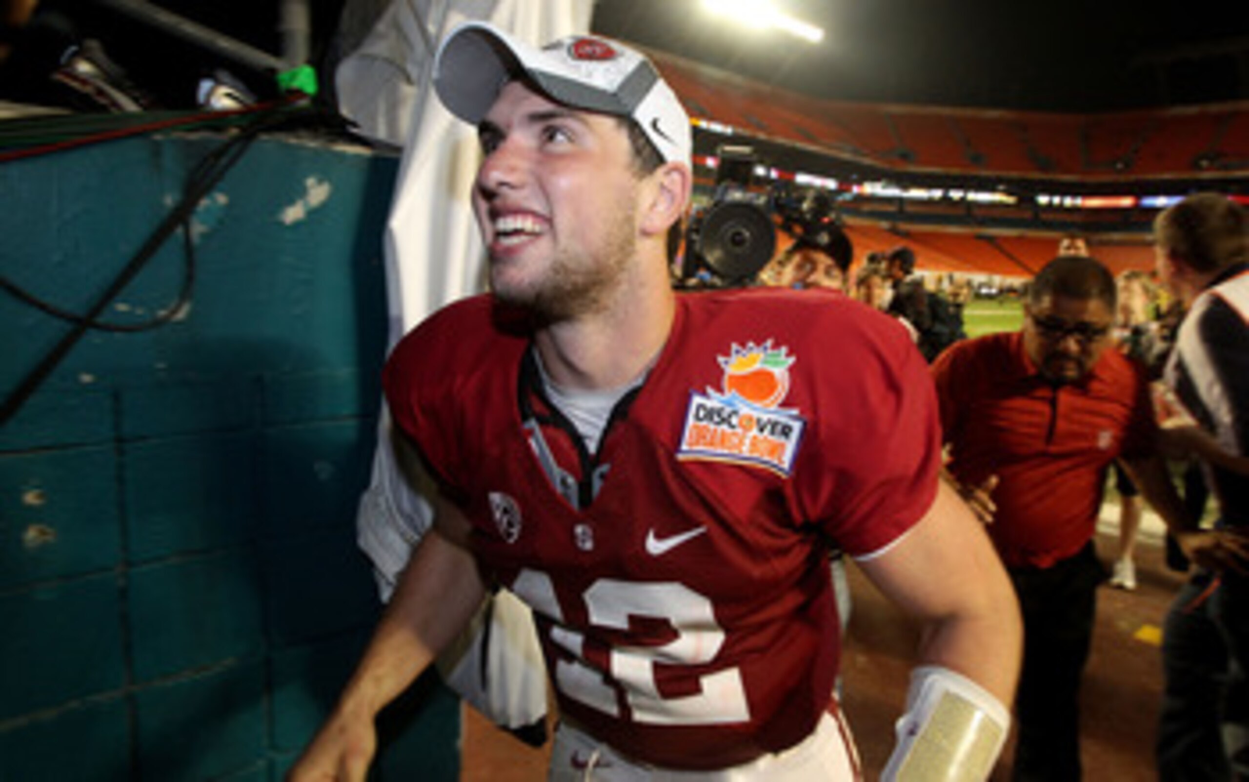 MIAMI, FL - JANUARY 03:  Andrew Luck #12 of the Stanford Cardinal celebrates as he walks off the field after Stanford won 40-12 against the Virginia Tech Hokies during the 2011 Discover Orange Bowl at Sun Life Stadium on January 3, 2011 in Miami, Florida.