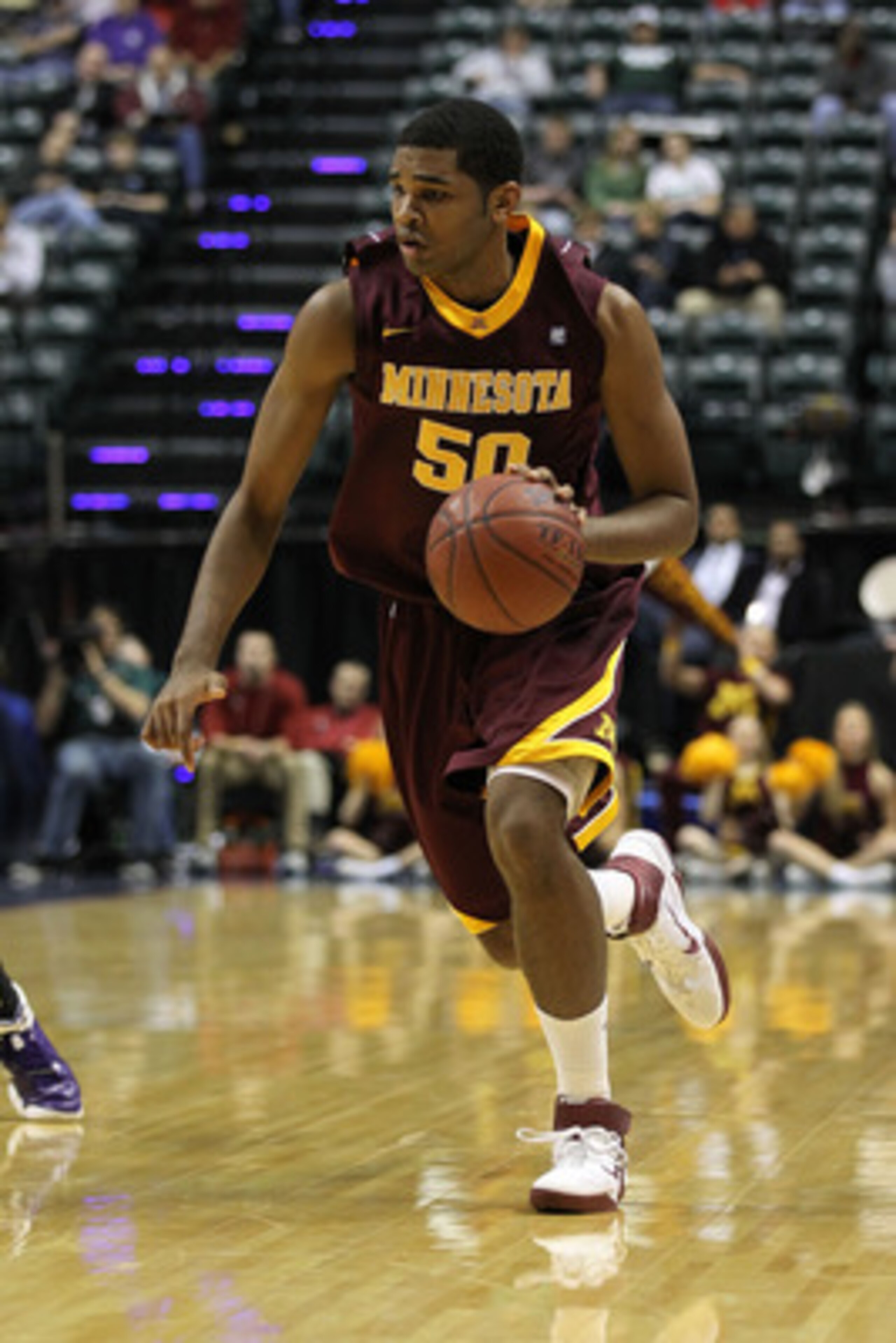 INDIANAPOLIS, IN - MARCH 10:  Ralph Sampson III #50 of the Minnesota Golden Gophers drives against the Northwestern Wildcats during the first round of the 2011 Big Ten Men's Basketball Tournament at Conseco Fieldhouse on March 10, 2011 in Indianapolis, In
