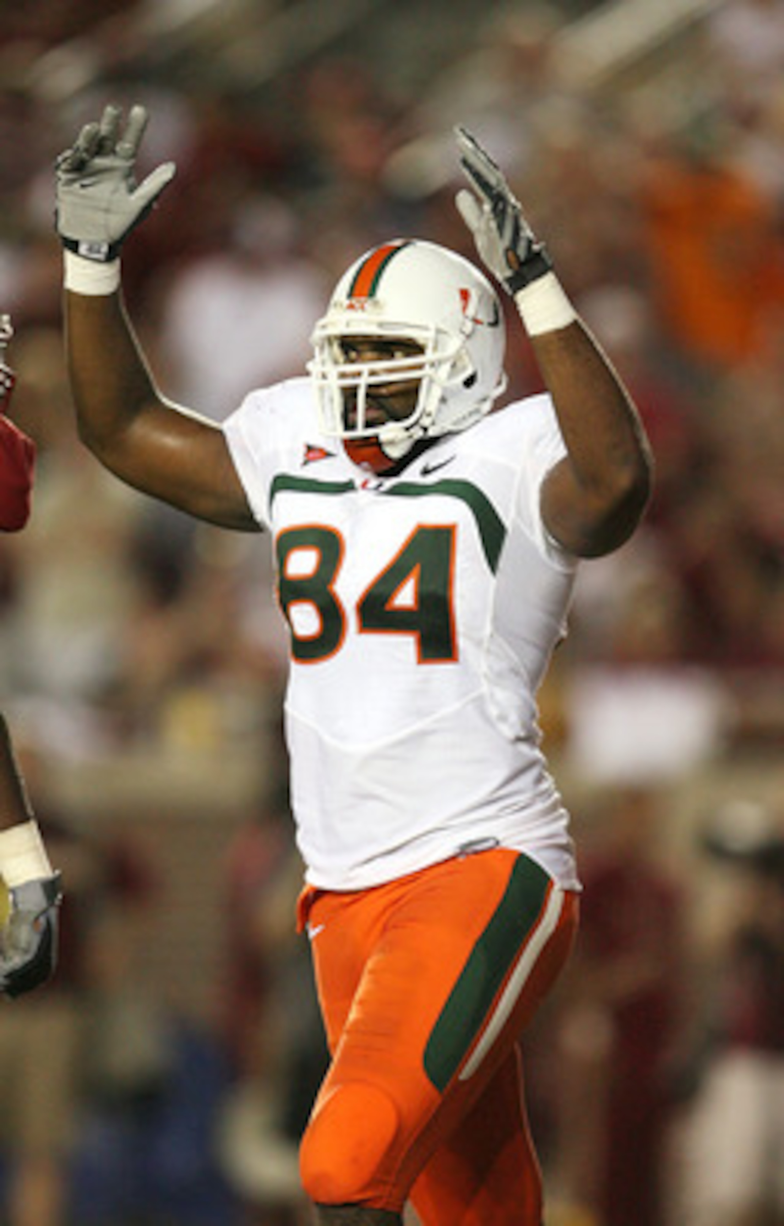TALLAHASSEE, FL - SEPTEMBER 07: Tight end Richard Gordon #84 of the Miami Hurricanes celebrates after a fourth quarter touchdown by running back Graig Cooper #32 against the Florida State Seminoles at Doak Campbell Stadium on September 7, 2009 in Tallaha TALLAHASSEE, FL - SEPTEMBER 07: Tight end Richard Gordon #84 of the Miami Hurricanes celebrates after a fourth quarter touchdown by running back Graig Cooper #32 against the Florida State Seminoles at Doak Campbell Stadium on September 7, 2009 in Tallaha