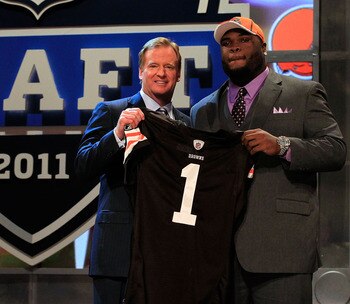 NEW YORK, NY - APRIL 28:  NFL Commissioner Roger Goodell (L) poses for a photo with Phil Taylor, #21 overall pick by the Cleveland Browns, on stage during the 2011 NFL Draft at Radio City Music Hall on April 28, 2011 in New York City.  (Photo by Chris Tro
