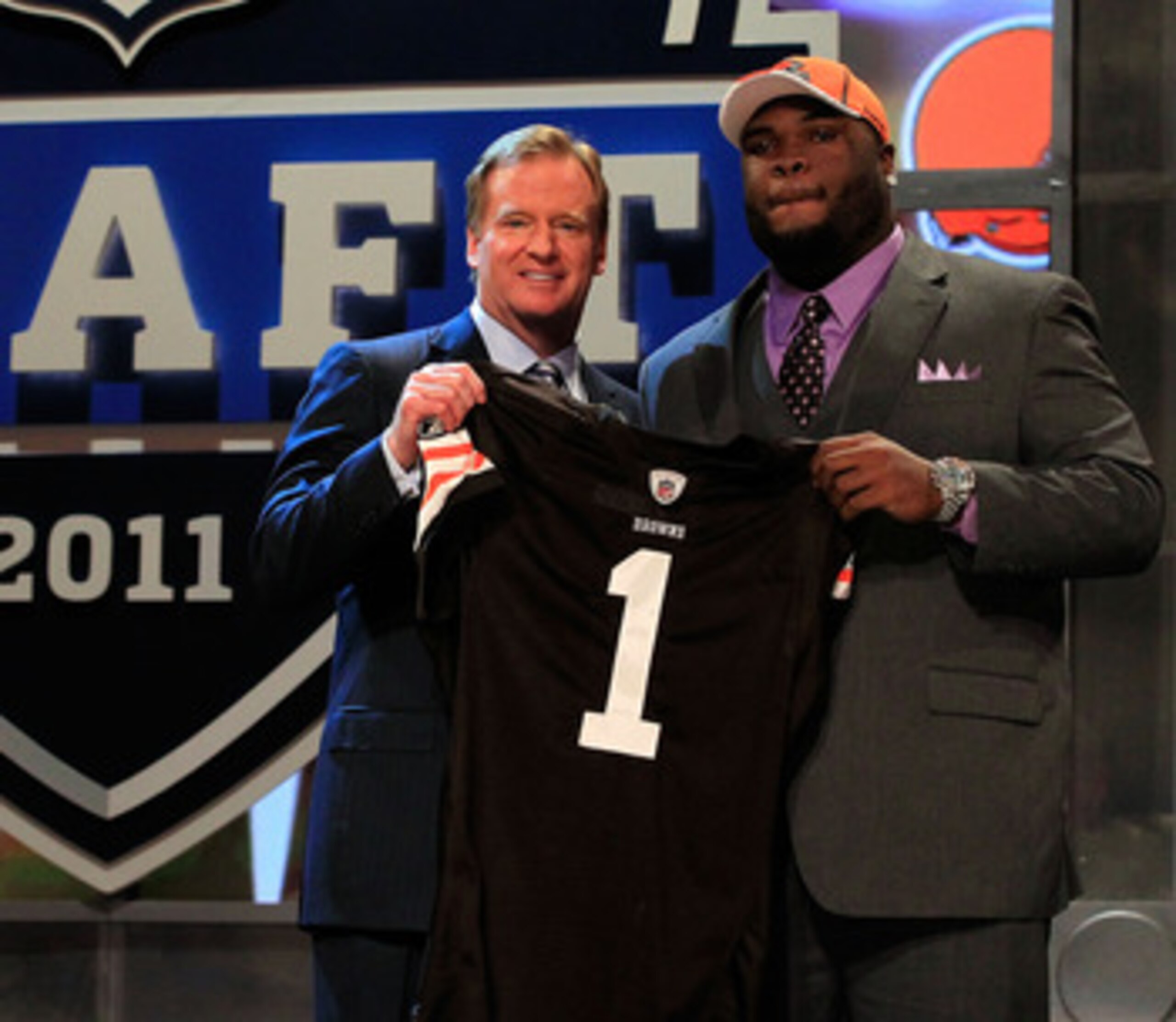 NEW YORK, NY - APRIL 28:  NFL Commissioner Roger Goodell (L) poses for a photo with Phil Taylor, #21 overall pick by the Cleveland Browns, on stage during the 2011 NFL Draft at Radio City Music Hall on April 28, 2011 in New York City.  (Photo by Chris Tro