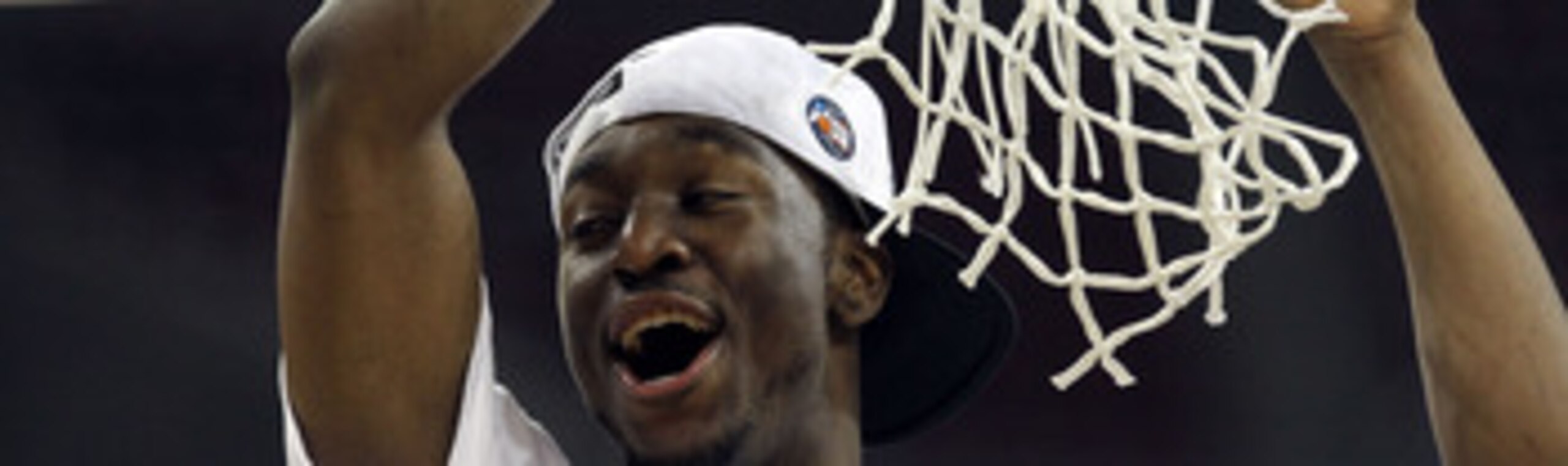 HOUSTON, TX - APRIL 04:  Kemba Walker #15 of the Connecticut Huskies cuts down the net after defeating the Butler Bulldogs to win the National Championship Game of the 2011 NCAA Division I Men's Basketball Tournament by a score of 53-41 at Reliant Stadium