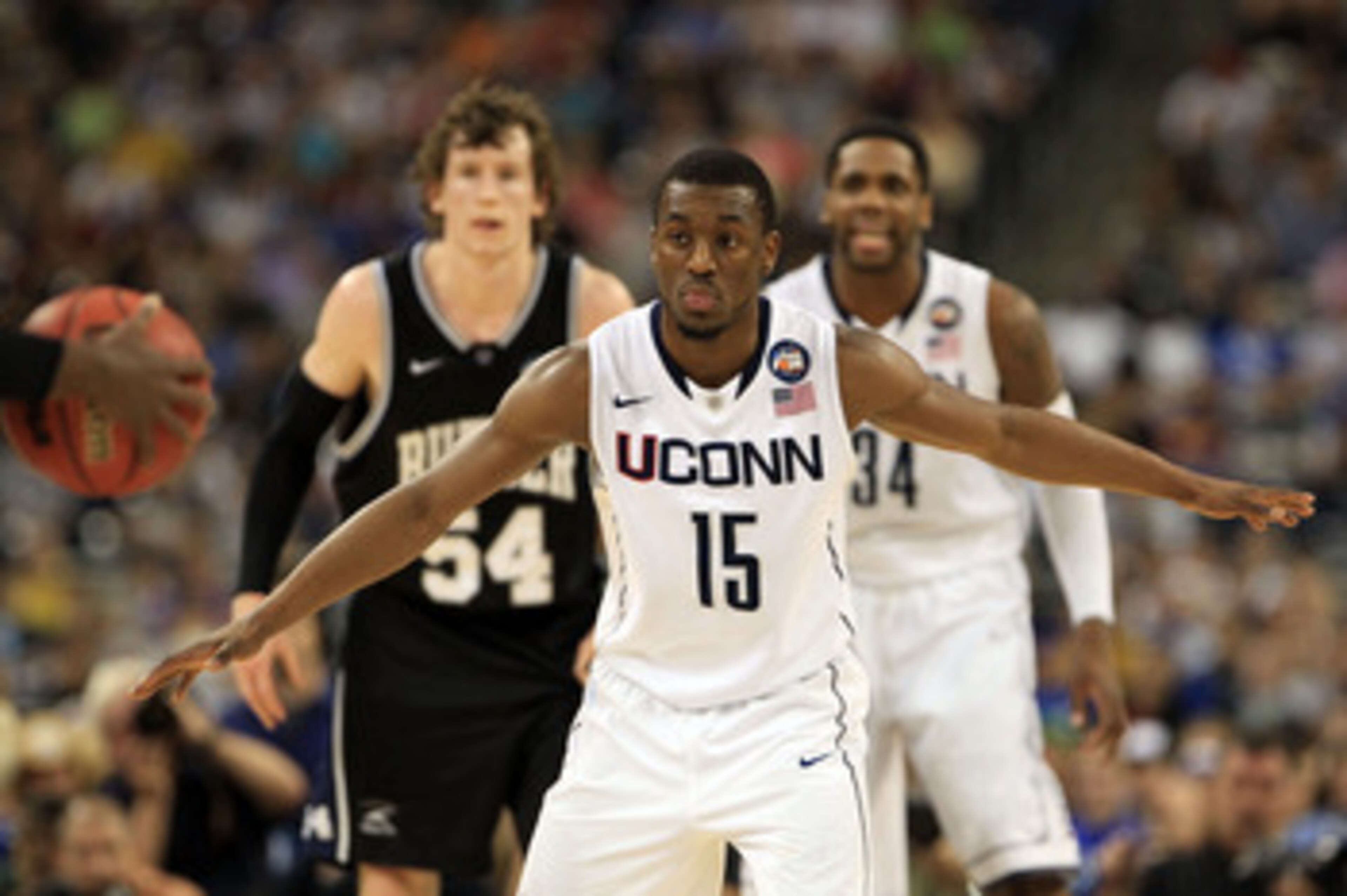 HOUSTON, TX - APRIL 04: Kemba Walker #15 of the Connecticut Huskies looks on against the Butler Bulldogs during the National Championship Game of the 2011 NCAA Division I Men's Basketball Tournament at Reliant Stadium on April 4, 2011 in Houston, Texas. HOUSTON, TX - APRIL 04: Kemba Walker #15 of the Connecticut Huskies looks on against the Butler Bulldogs during the National Championship Game of the 2011 NCAA Division I Men's Basketball Tournament at Reliant Stadium on April 4, 2011 in Houston, Texas.