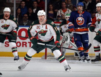 UNIONDALE, NY - MARCH 02:  John Madden #11 of the Minnesota Wild skates against the New York Islanders at the Nassau Coliseum on March 2, 2011 in Uniondale, New York. The Islanders defeated the Wild 4-1.  (Photo by Bruce Bennett/Getty Images)