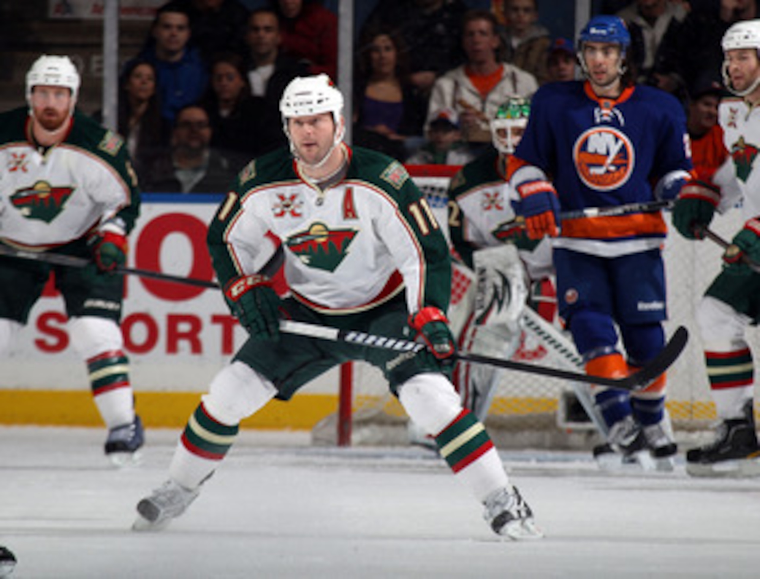 UNIONDALE, NY - MARCH 02:  John Madden #11 of the Minnesota Wild skates against the New York Islanders at the Nassau Coliseum on March 2, 2011 in Uniondale, New York. The Islanders defeated the Wild 4-1.  (Photo by Bruce Bennett/Getty Images)