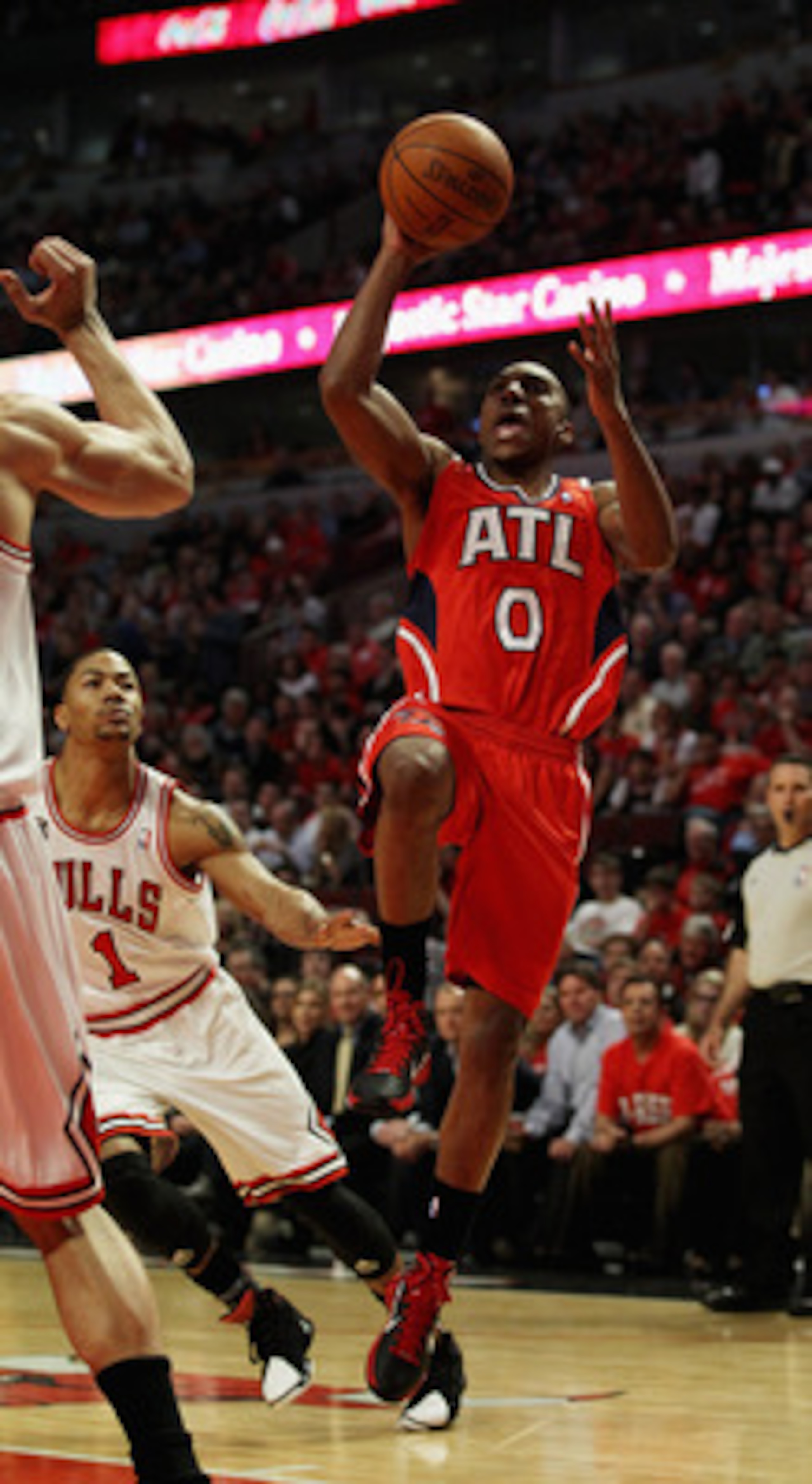CHICAGO, IL - MAY 02: Jeff Teague #0 of the Atlanta Hawks puts up a shot past Derrick Rose #1 of the Chicago Bulls in Game One of the Eastern Conference Semifinals in the 2011 NBA Playoffs at the United Center on May 2, 2011 in Chicago, Illinois. NOTE TO 