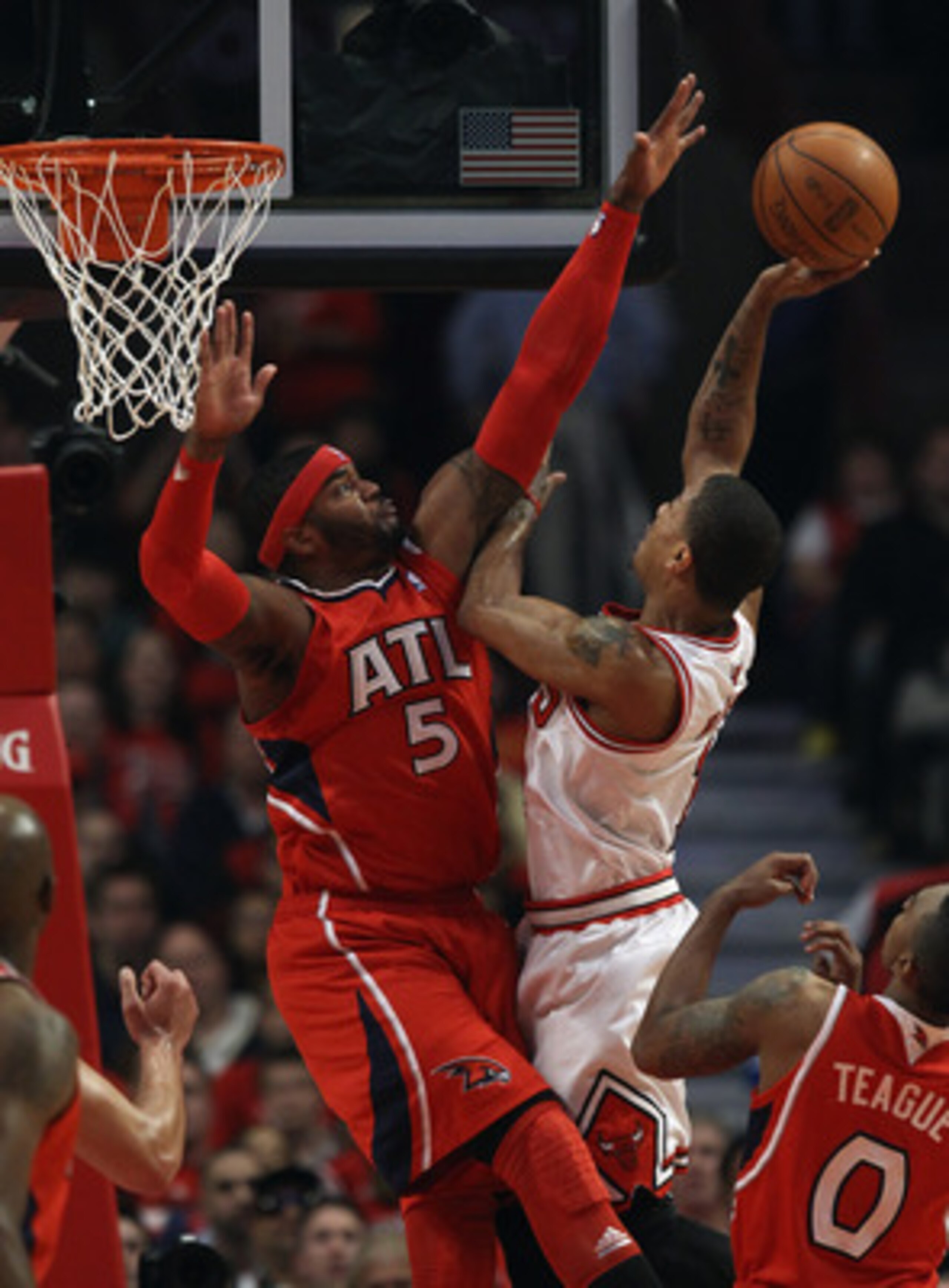 CHICAGO, IL - MAY 02: Derrick Rose #1 of the Chicago Bulls goes up against Josh Smith #5 of the Atlanta Hawks in Game One of the Eastern Conference Semifinals in the 2011 NBA Playoffs at the United Center on May 2, 2011 in Chicago, Illinois. NOTE TO USER: