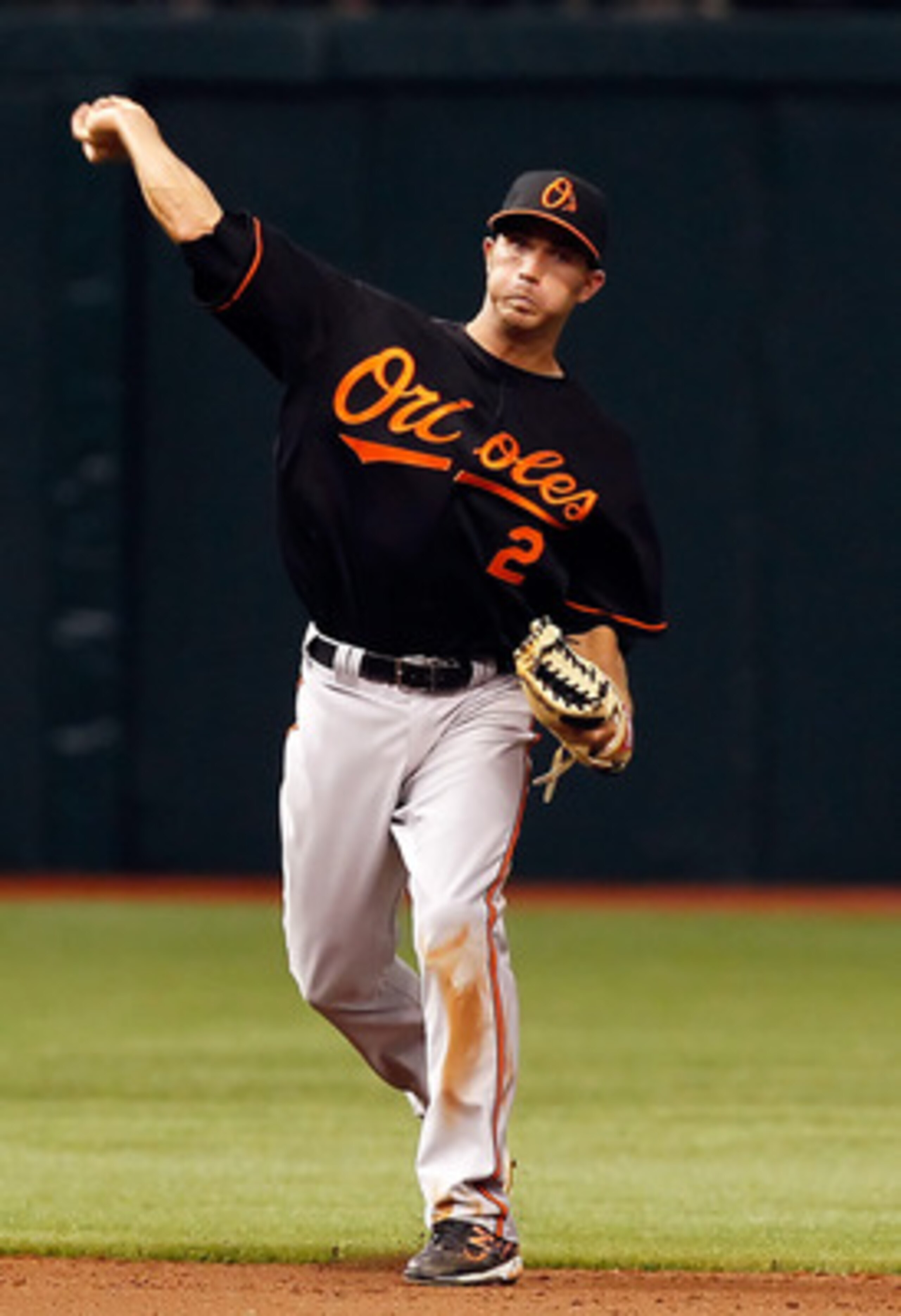 ST. PETERSBURG, FL - APRIL 01:  Shortstop J.J. Hardy #2 of the Baltimore Orioles throws over to first for the final out against the Tampa Bay Rays during the Opening Day game at Tropicana Field on April 1, 2011 in St. Petersburg, Florida.  (Photo by J. Me