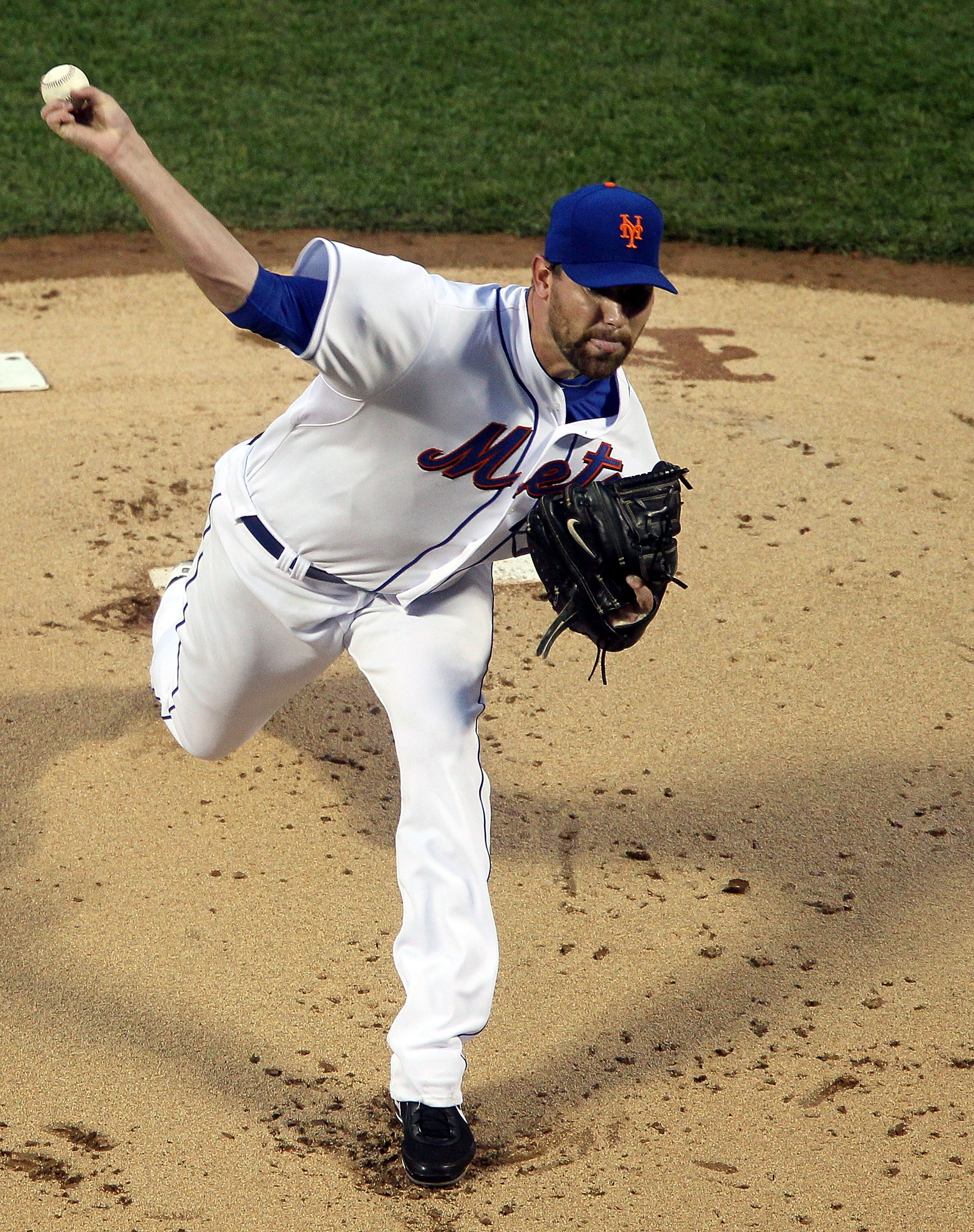 NEW YORK, NY - APRIL 11:  Mike Pelfrey #34 of the New York Mets deals a pitch against the Colorado Rockies on April 11, 2011 at Citi Field in the Flushing neighborhood of the Queens borough of New York City.  (Photo by Jim McIsaac/Getty Images)