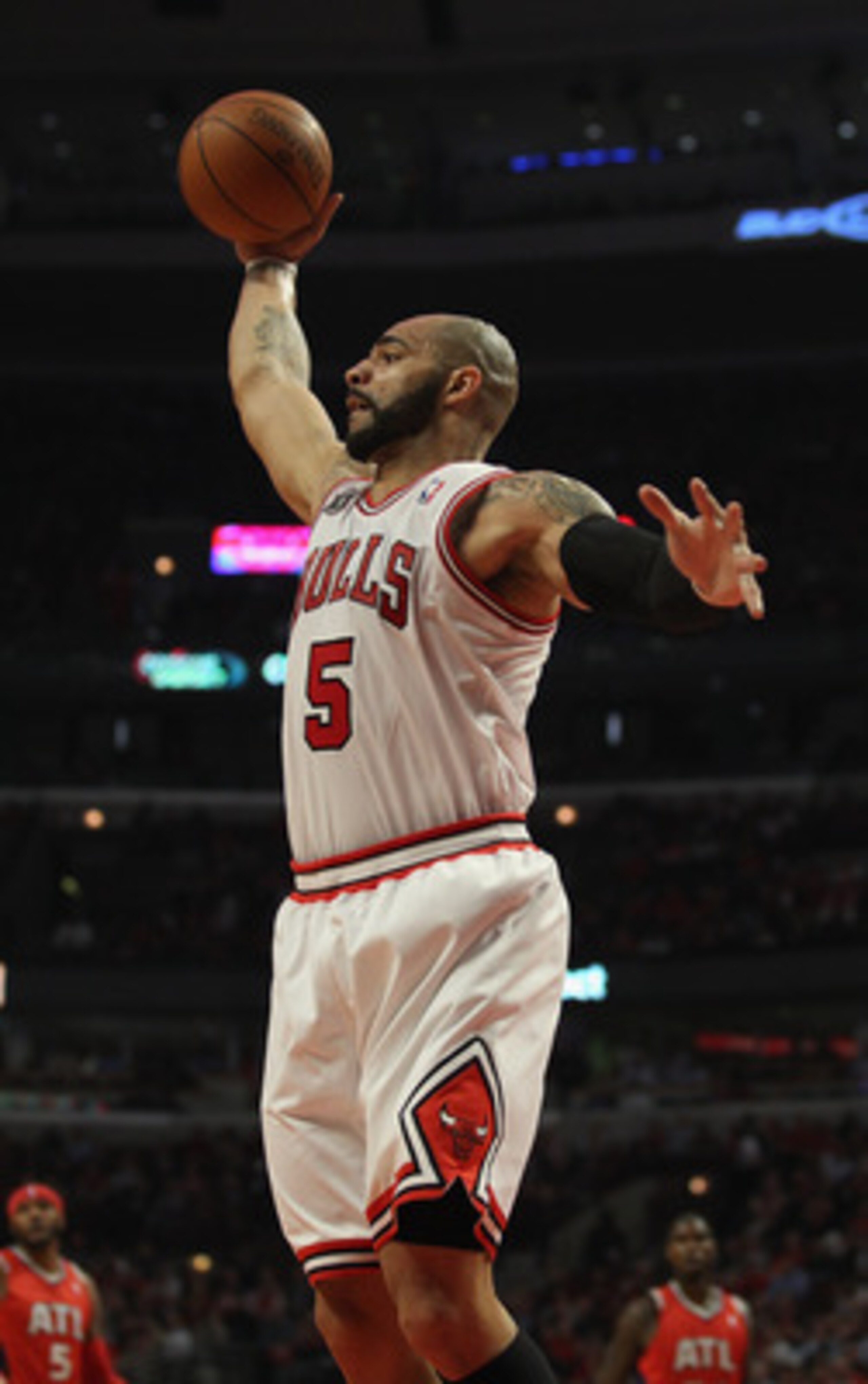 CHICAGO, IL - MAY 02: Carlos Boozer #5 of the Chicago Bulls grabs a rebound against the Atlanta Hawks in Game One of the Eastern Conference Semifinals in the 2011 NBA Playoffs at the United Center on May 2, 2011 in Chicago, Illinois. The Hawks defeated th