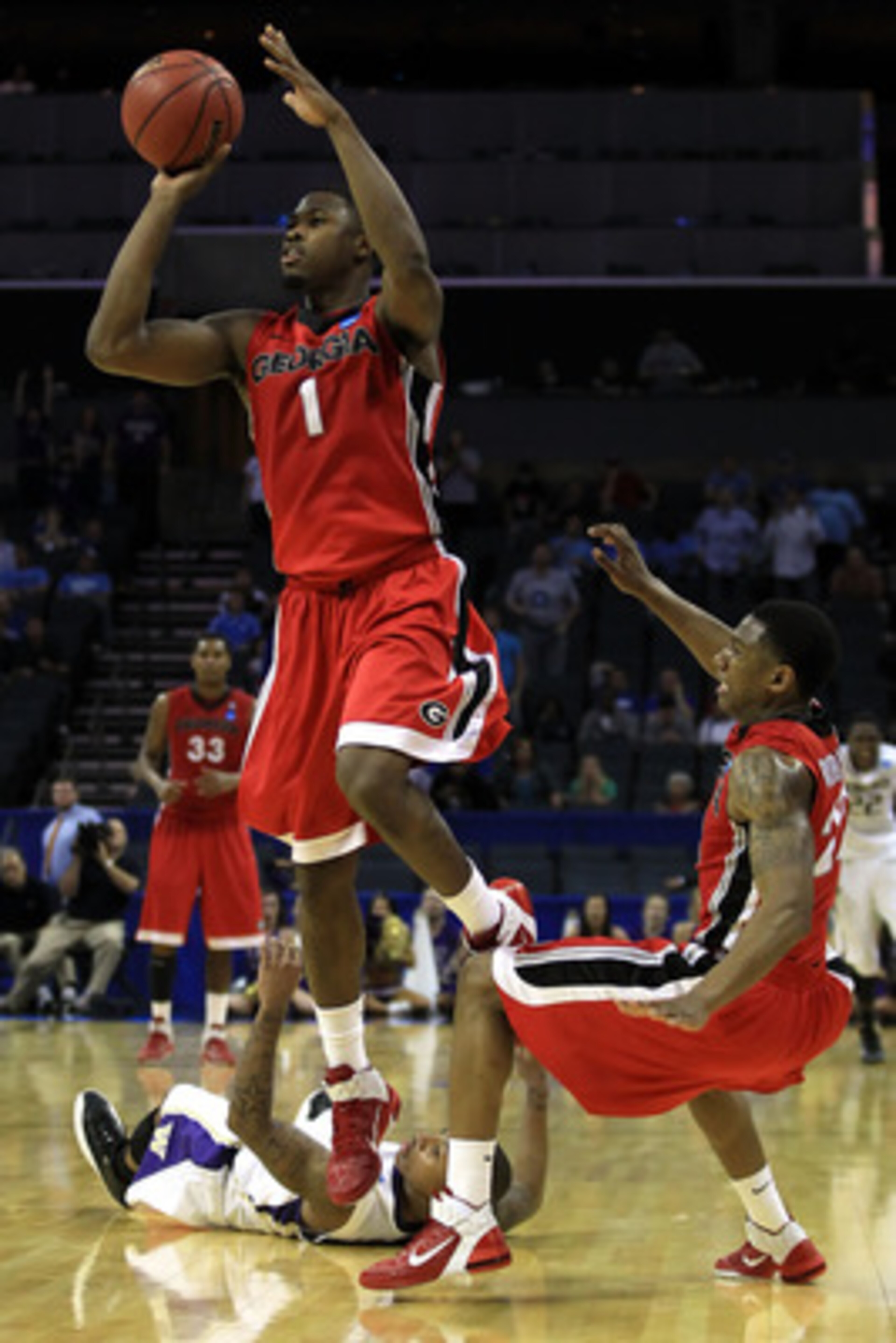 CHARLOTTE, NC - MARCH 18: Travis Leslie #1 of the Georgia Bulldogs misses a last second three-pointer that would have tied the game against the Washington Huskies during the second round of the 2011 NCAA men's basketball tournament at Time Warner Cable A CHARLOTTE, NC - MARCH 18: Travis Leslie #1 of the Georgia Bulldogs misses a last second three-pointer that would have tied the game against the Washington Huskies during the second round of the 2011 NCAA men's basketball tournament at Time Warner Cable A