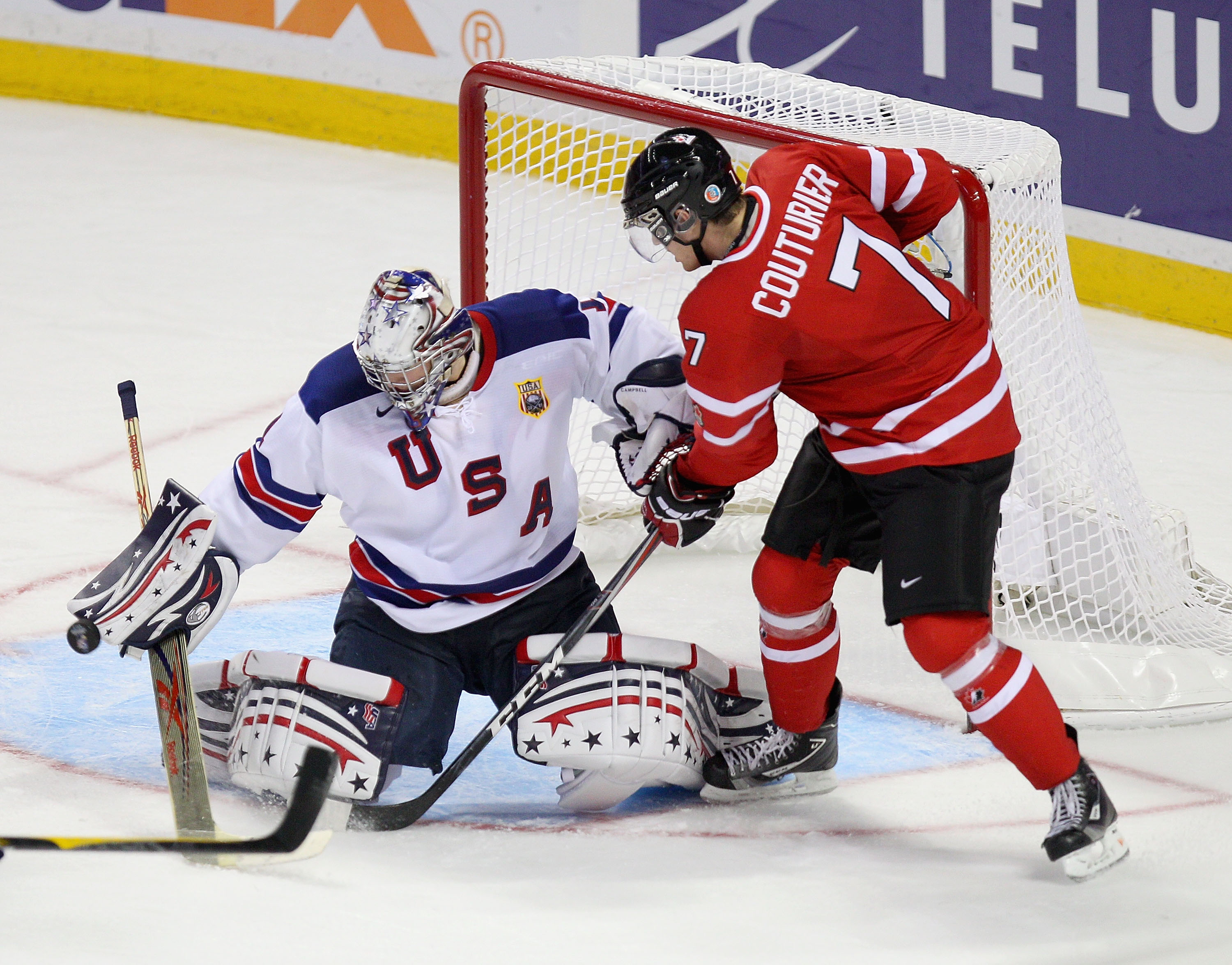 BUFFALO, NY - JANUARY 03:  Jack Campbell #1 of the United States makes a save on Sean Couturier #7 of Canada during the 2011 IIHF World U20 Championship Semi Final game between United States and Canada on January 3, 2011 in Buffalo, New York.  (Photo by R