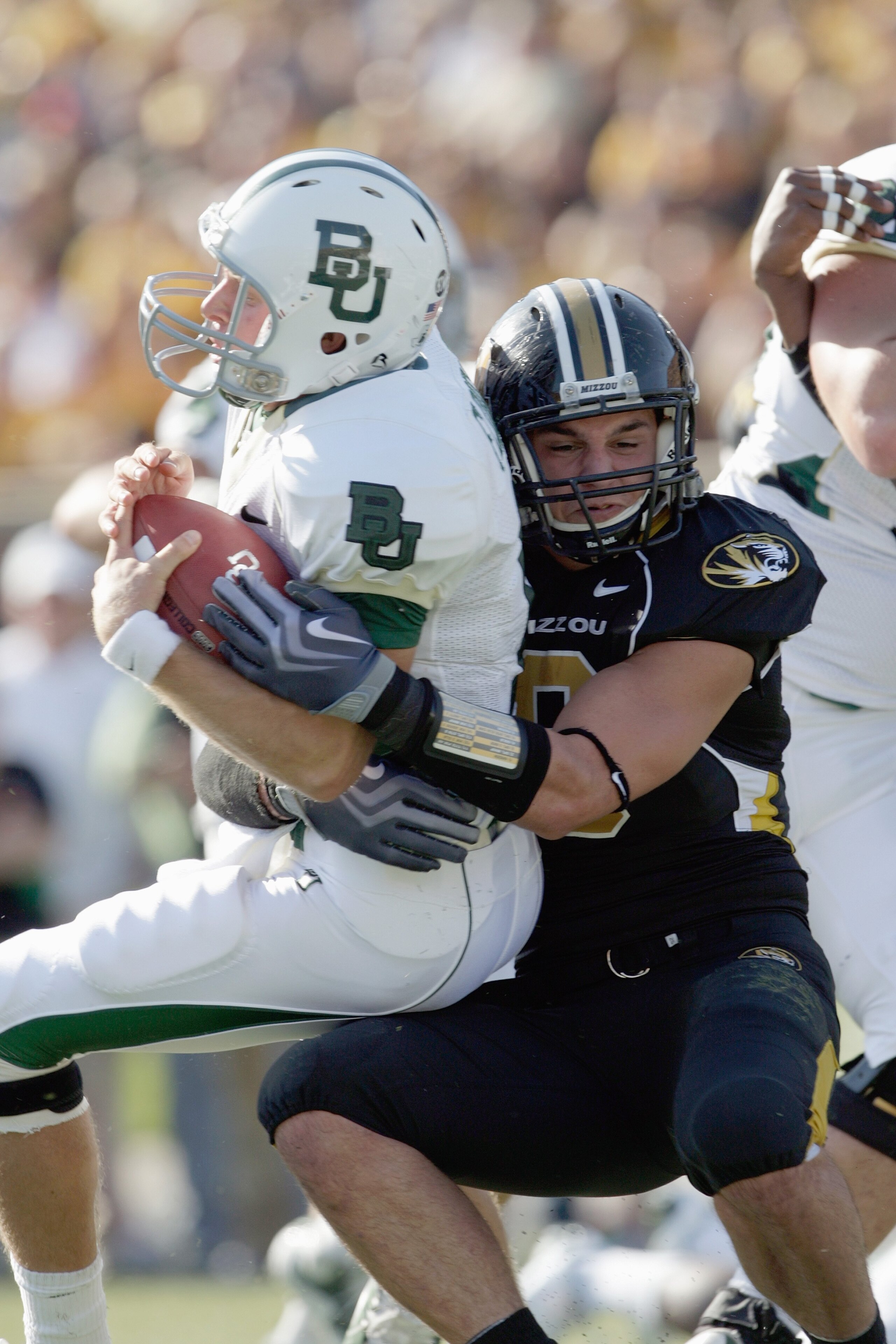 COLUMBIA, MO - NOVEMBER 7:  Quarterback Nick Florence #11 of the Baylor Bears is sacked during the game against the Missouri Tigers at Faurot Field at Memorial Stadium on November 7, 2009 in Columbia, Missouri. (Photo by Jamie Squire/Getty Images)