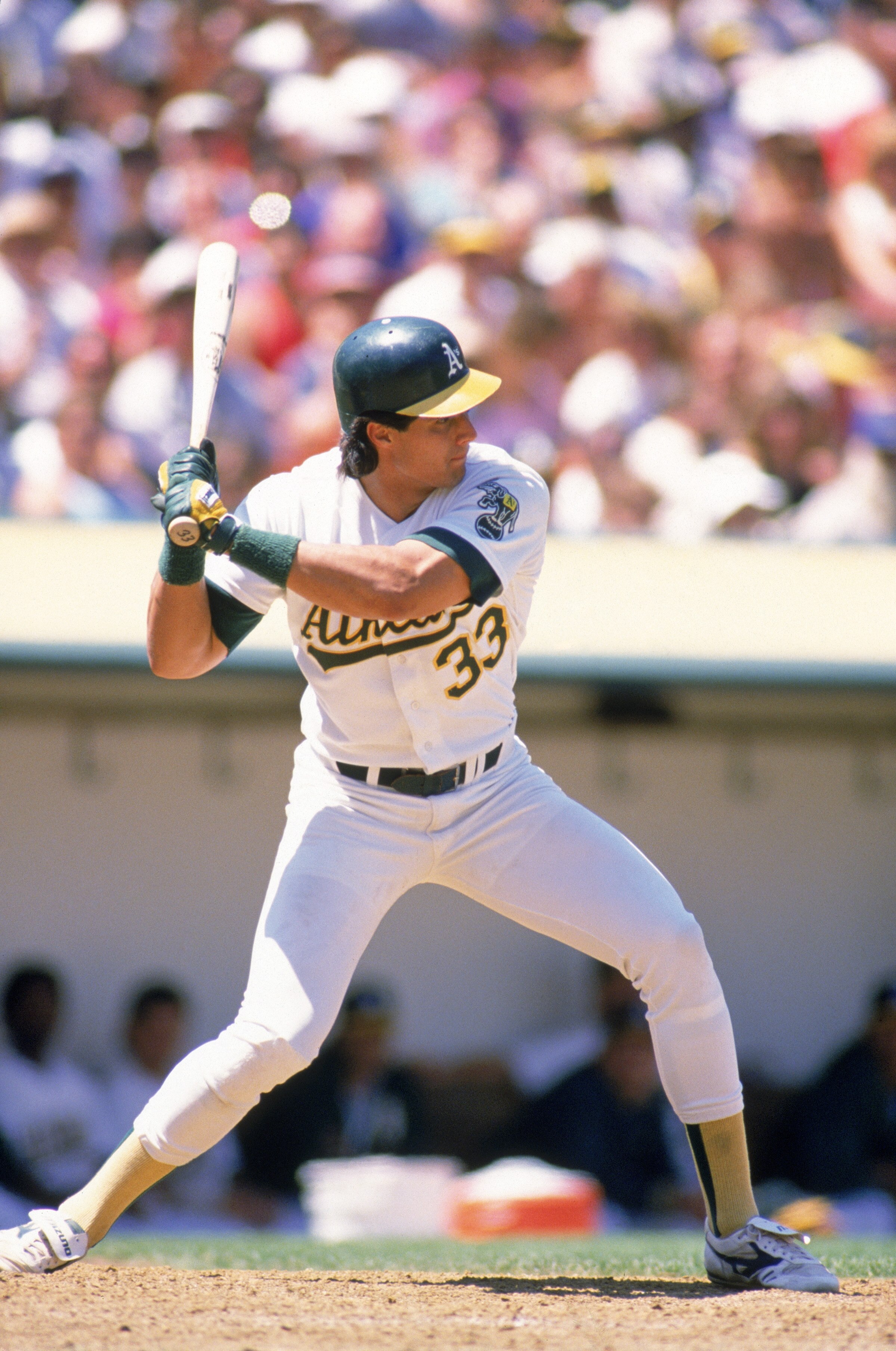 OAKLAND, CA -1988:  Jose Canseco #33 of the Oakland Athletics prepares to swing during his at bat in a 1988 MLB season game at Oakland-Alameda County Coliseum in Oakland, California.  (Photo by Otto Greule Jr/Getty Images)