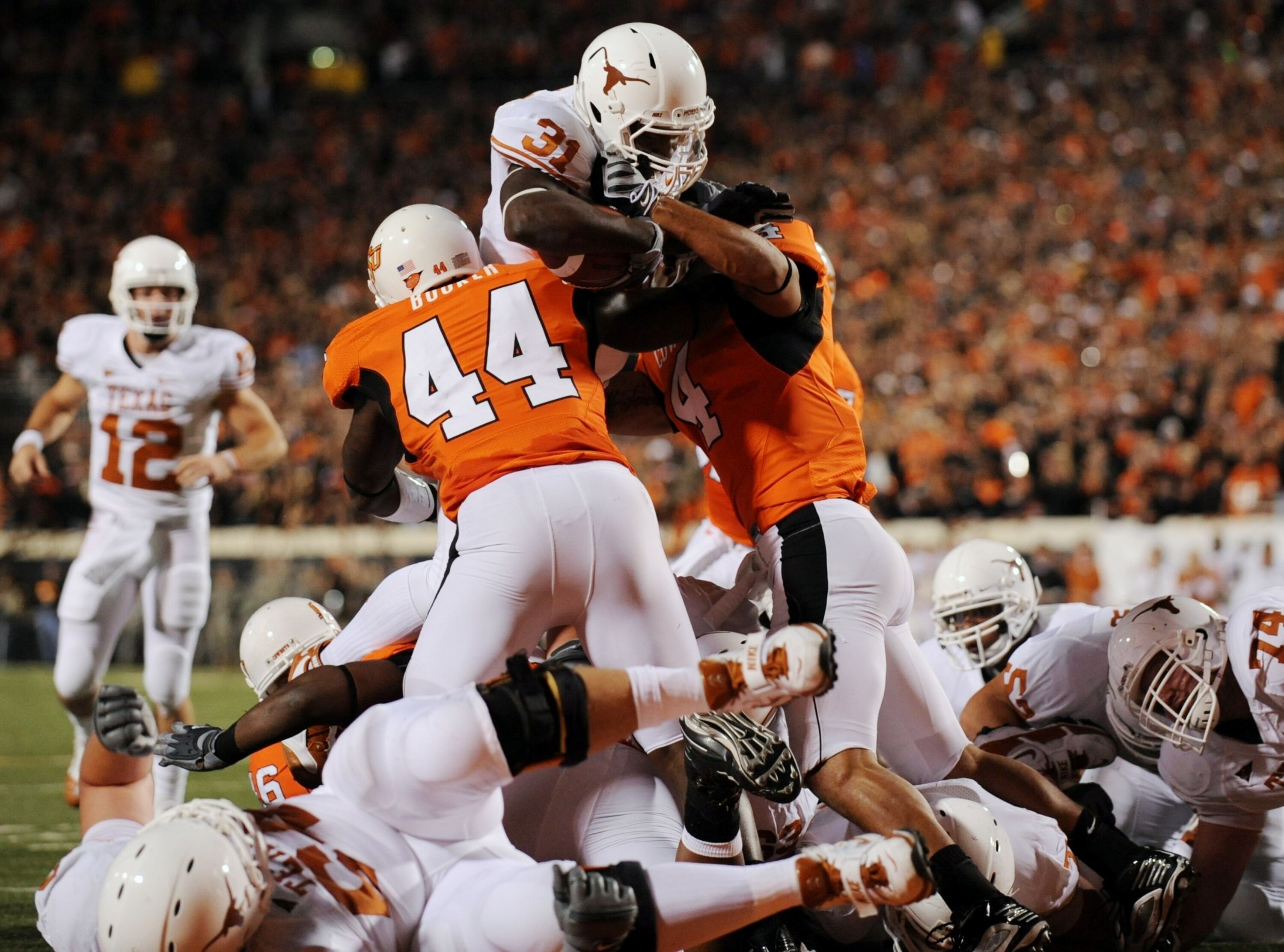STILLWATER, OK - OCTOBER 31:  Cody Johnson #31 of the Texas Longhorns scores a touchdown in the second quarter of the game against the Oklahoma State Cowboys at Boone Pickens Stadium on October 31, 2009 in Stillwater, Oklahoma.  (Photo by Ronald Martinez/