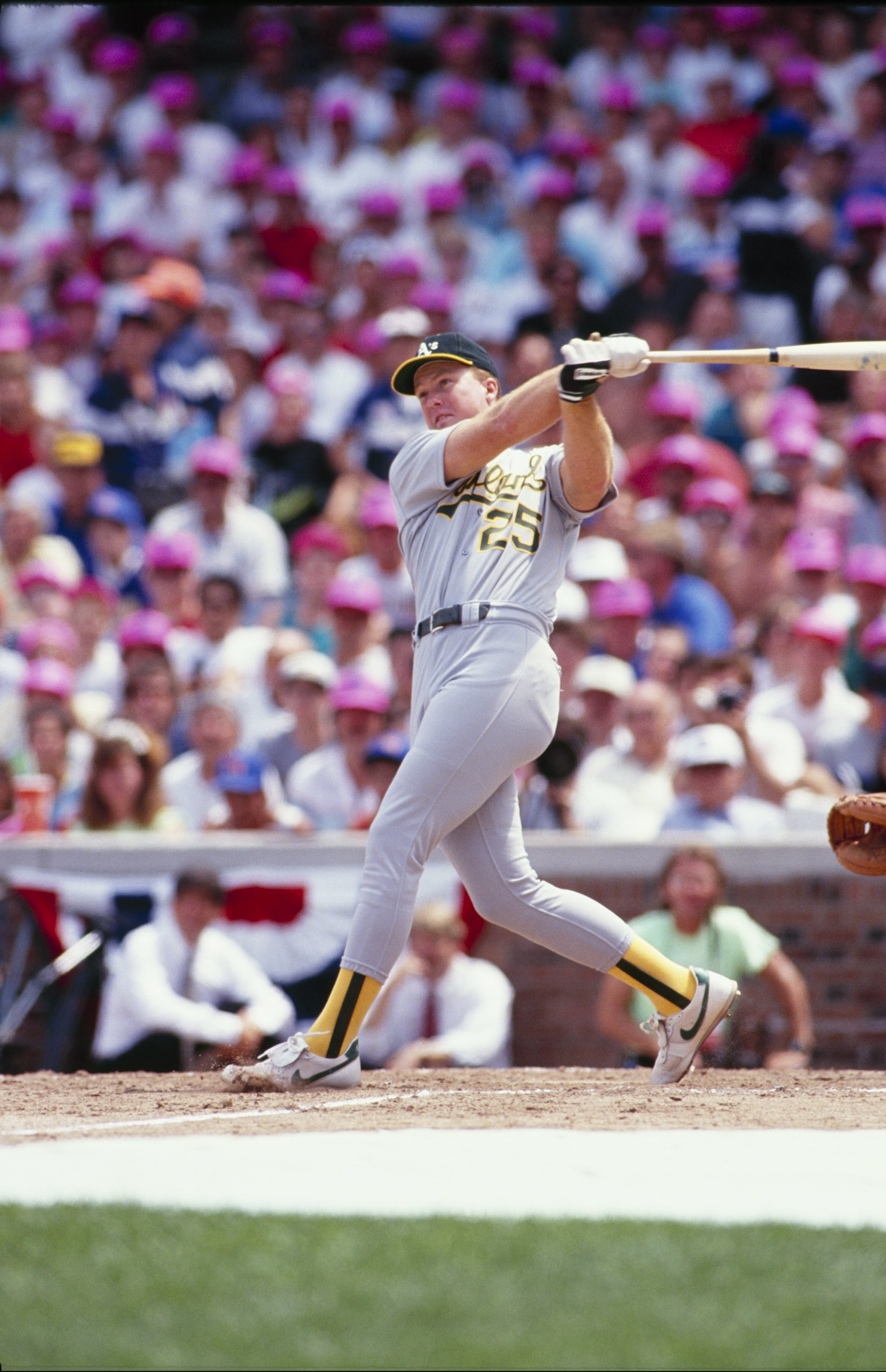 CHICAGO - JULY 1990:  Mark McGuire #25 of the Oakland Athletics bats during batting practice prior to the1990 All-Star Game at Wrigley Field circa July 1990 in Chicago, Illinois. (Photo by Steve Goldstein/Getty Images)