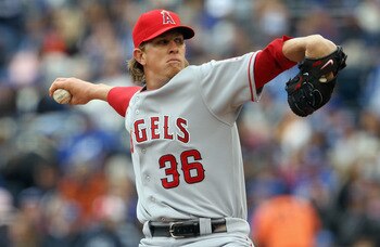 KANSAS CITY, MO - MARCH 31:  Starting pitcher Jered Weaver #36 of the Los Angeles Angels of Anaheim delivers his first pitch during the 1st inning of the opening day game against the Kansas City Royals at Kauffman Stadium on March 31, 2011 in Kansas City,