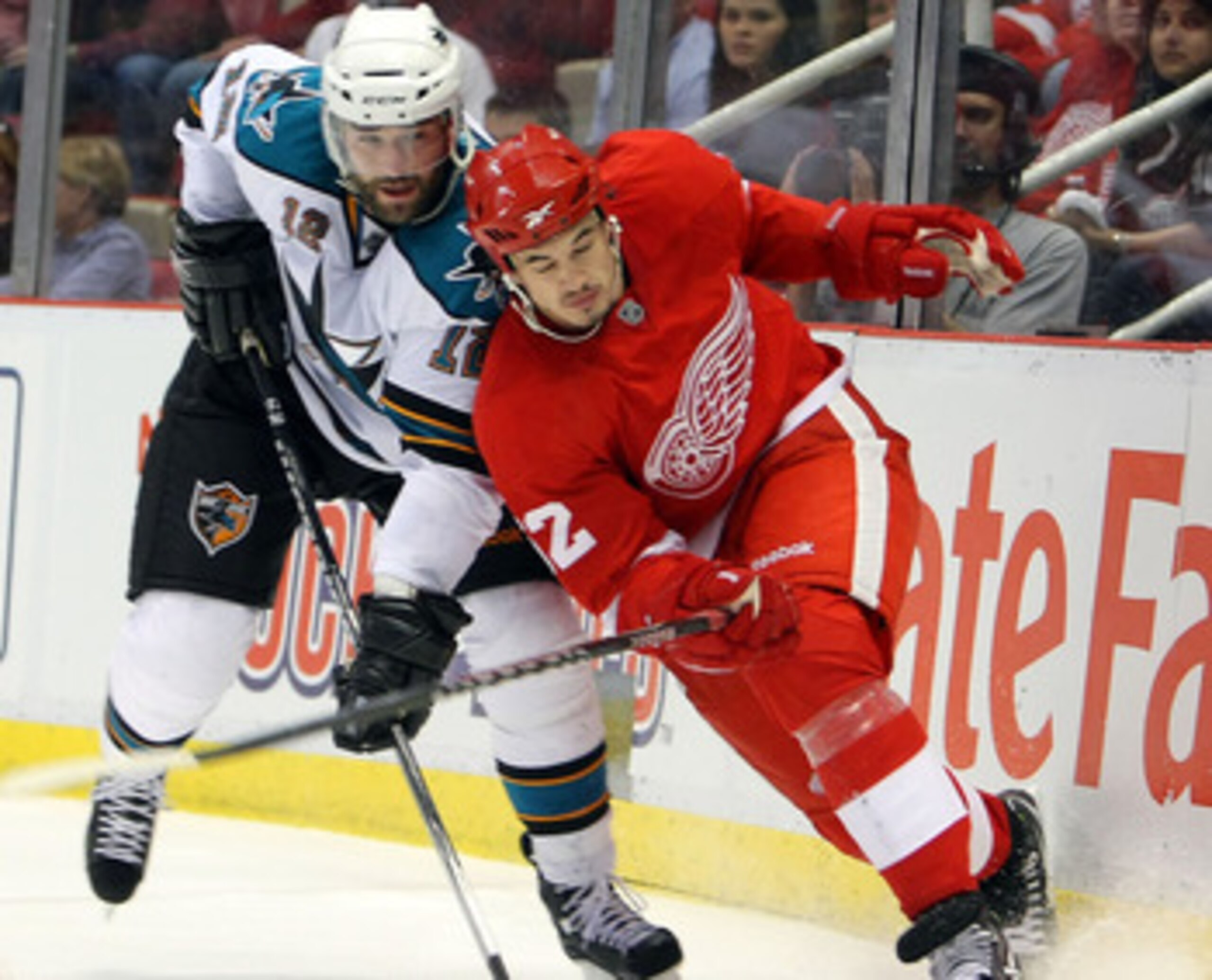 DETROIT - MAY 4:  Patrick Marleau #12 of the San Jose Sharks battles for position with Jonathan Ericsson #52 of the Detroit Red Wings in Game Three of the Western Conference Semifinals during the 2010 Stanley Cup Playoffs at Joe Louis Arena on May 4, 2010