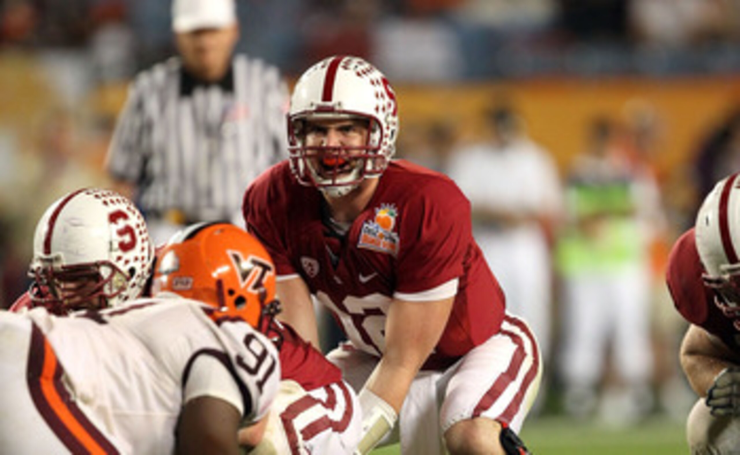 MIAMI, FL - JANUARY 03:  Andrew Luck #12 of the Stanford Cardinal callls signals out as he stands under center against the Virginia Tech Hokies during the 2011 Discover Orange Bowl at Sun Life Stadium on January 3, 2011 in Miami, Florida. Stanford won 40-