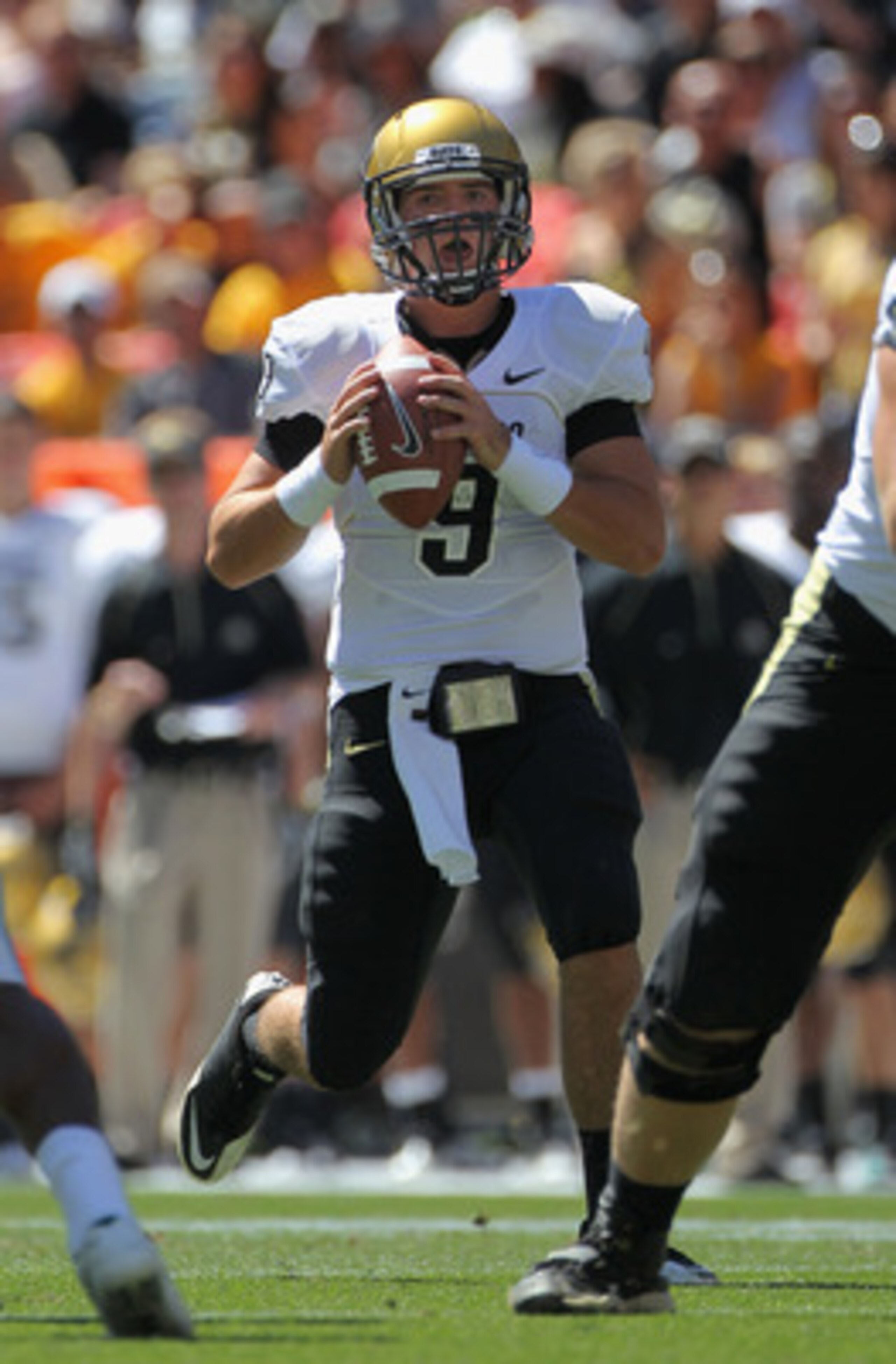 DENVER - SEPTEMBER 04:  Quarterback Tyler Hansen  #9 of the Colorado Buffaloes drops back to pass against the Colorado State Rams in the Rocky Mountain Showdown at INVESCO Field at Mile High on September 4, 2010 in Denver, Colorado. Colorado was awarded t