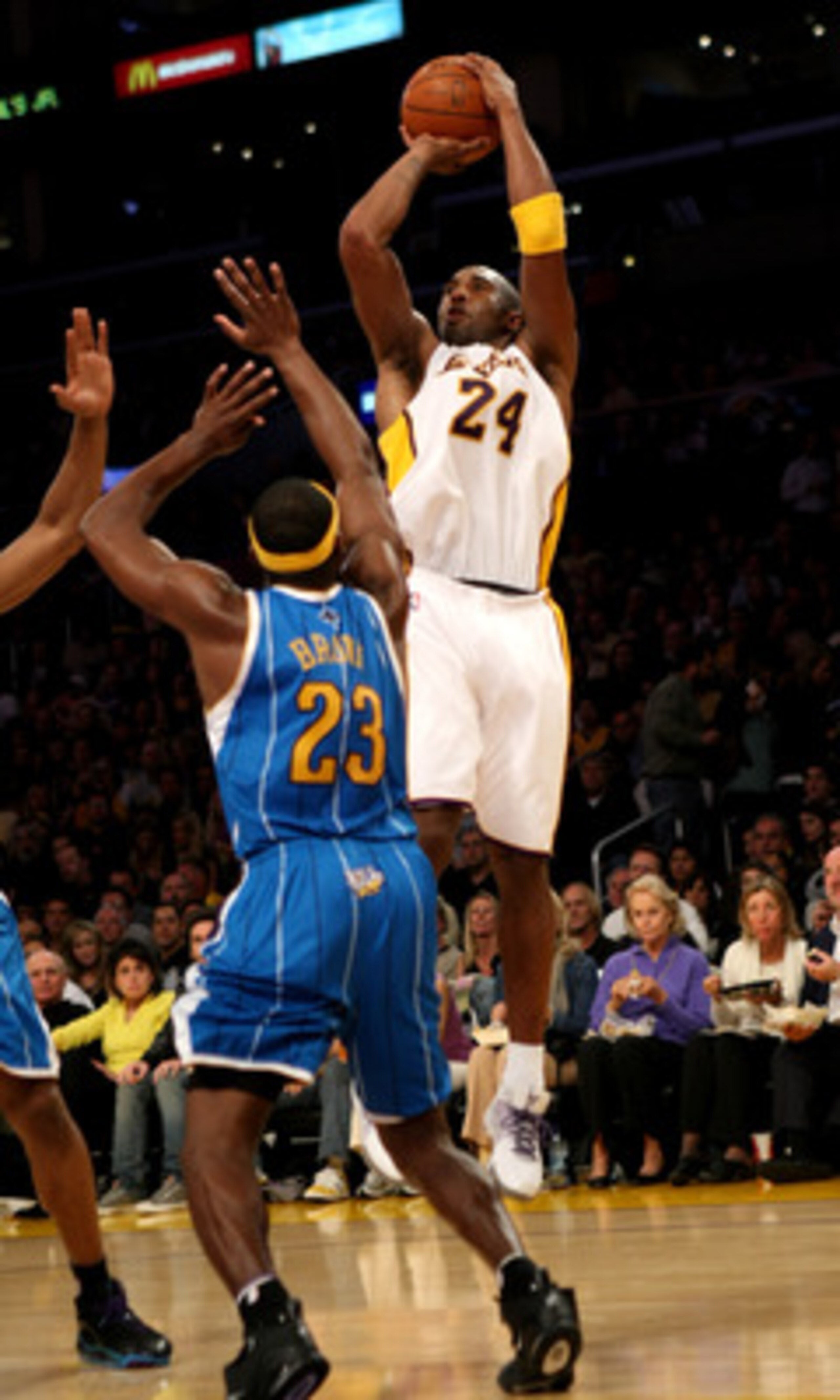 LOS ANGELES, CA - NOVEMBER 08:  Kobe Bryant #24 of the Los Angeles Lakers shoots over Devin Brown #23 of the New Orleans Hornets on November 8, 2009 at Staples Center in Los Angeles, California.  NOTE TO USER: User expressly acknowledges and agrees that, 