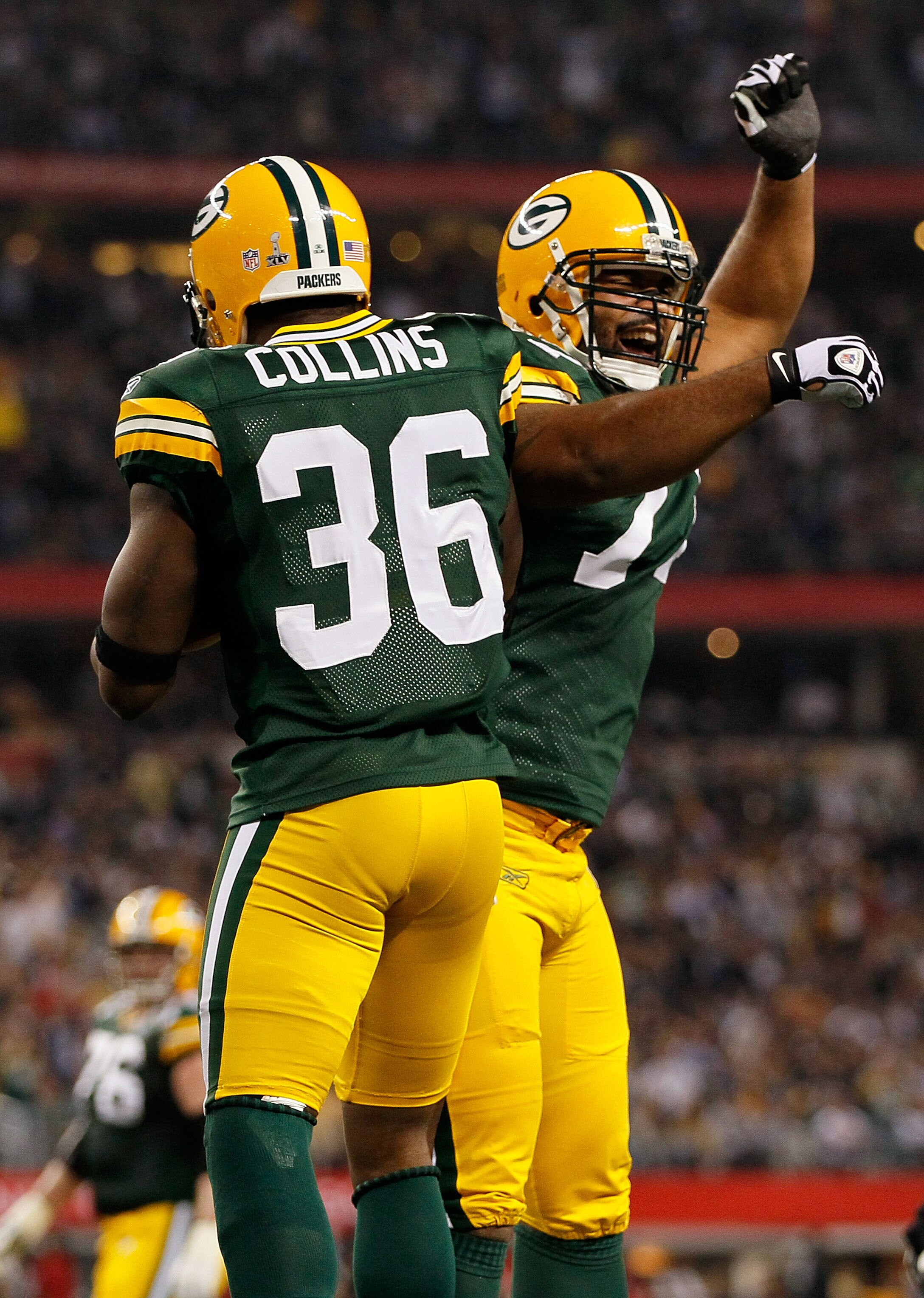 ARLINGTON, TX - FEBRUARY 06: Nick Collins #36 and Cullen Jenkins #77 of the Green Bay Packers celebrate after Collins returns an interception for a touchdown against the Pittsburgh Steelers during Super Bowl XLV at Cowboys Stadium on February 6, 2011 in A