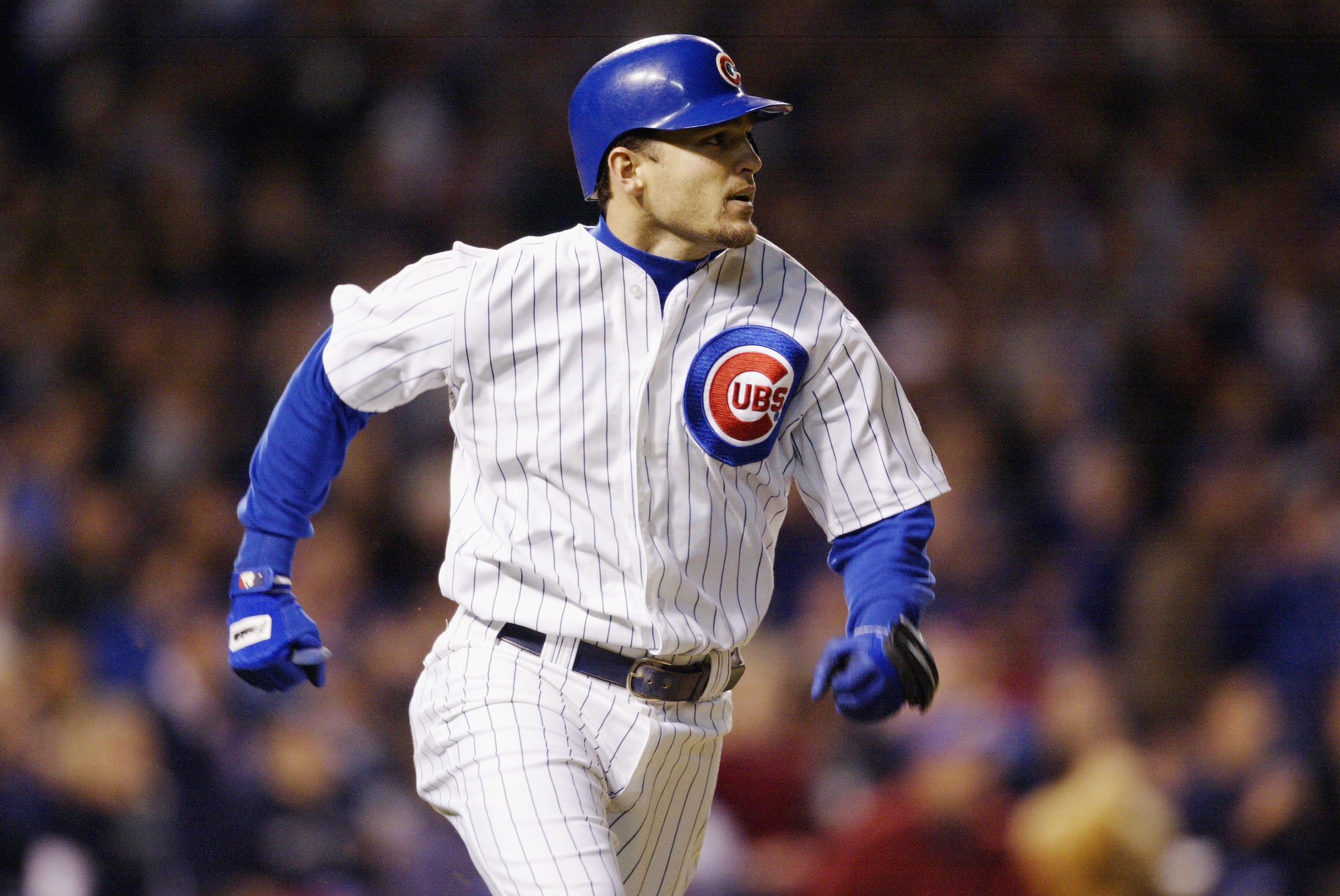 CHICAGO - OCTOBER 15:  Shortstop Alex Gonzalez #8 of the Chicago Cubs runs during game seven of the National League Championship Series against the Florida Marlins on October 15, 2003 at Wrigley Field in Chicago, Illinois. The Marlins won 9-6. (Photo by B