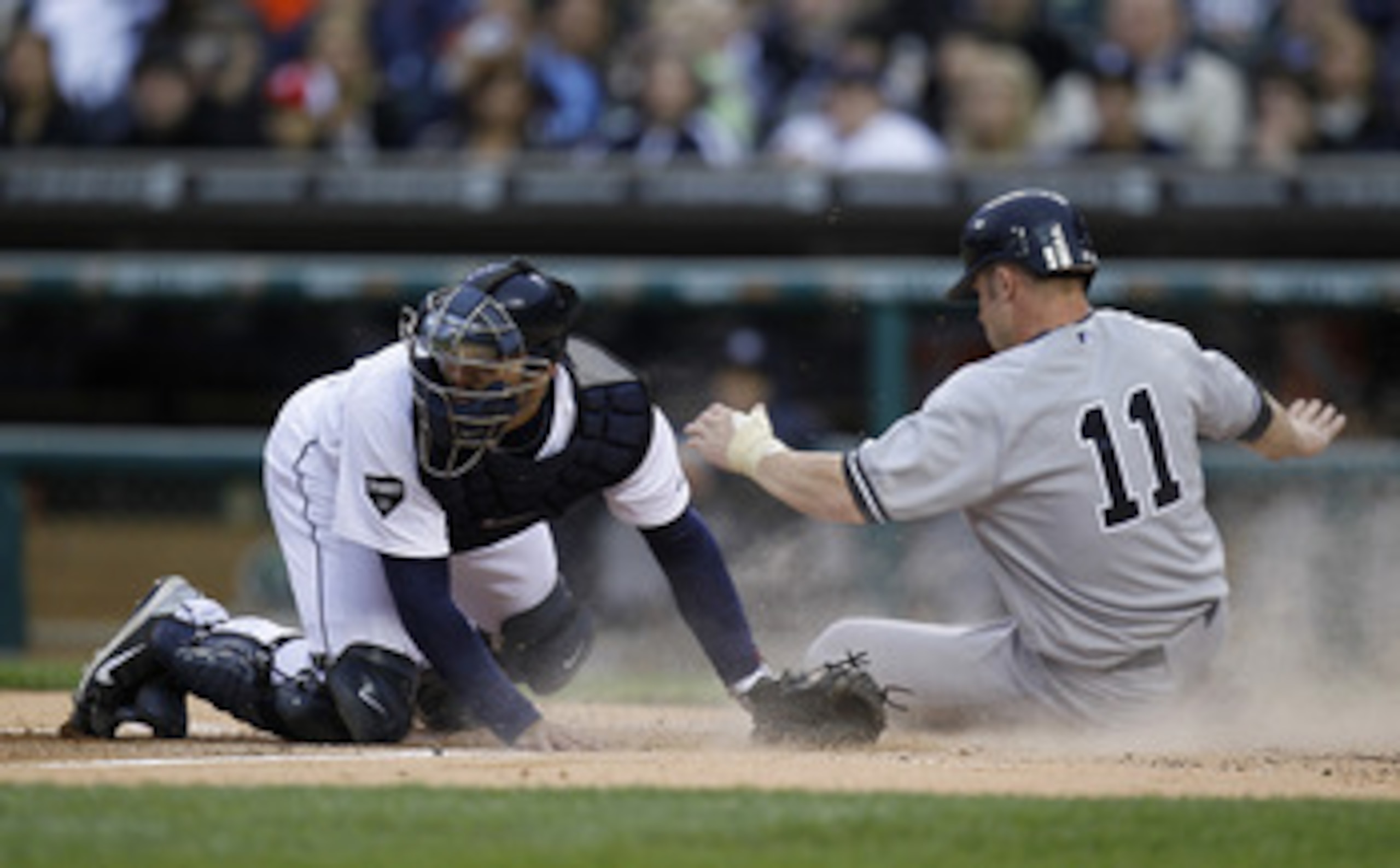 DETROIT, MI - MAY 02:  Brett Gardner #11 of the New York Yankees scores a run past Alex Avila #13 of the Detroit Tigers during the second inning at Comerica Park on May 2, 2011 in Detroit, Michigan.  (Photo by Gregory Shamus/Getty Images)