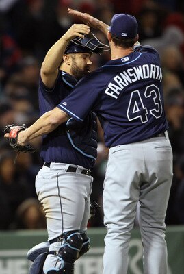 BOSTON, MA - APRIL 12:  Kelly Shoppach #10 of the Tampa Bay Rays celebrates the win the teammate Kyle Farnsworth #43 on April 12, 2011 at Fenway Park in Boston, Massachusetts. The Tampa Bay Rays defeated the Boston Red Sox 3-2.  (Photo by Elsa/Getty Image