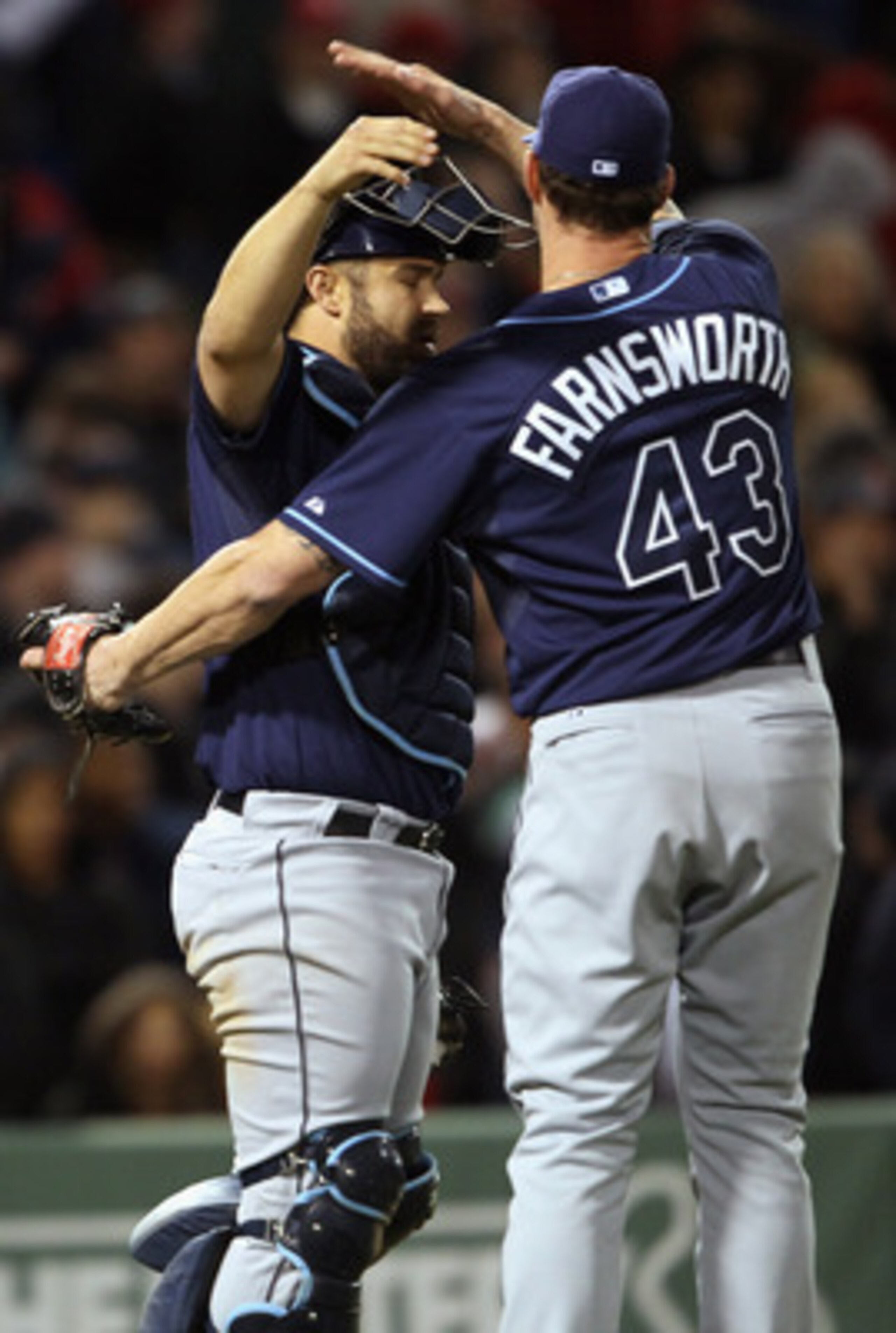 BOSTON, MA - APRIL 12:  Kelly Shoppach #10 of the Tampa Bay Rays celebrates the win the teammate Kyle Farnsworth #43 on April 12, 2011 at Fenway Park in Boston, Massachusetts. The Tampa Bay Rays defeated the Boston Red Sox 3-2.  (Photo by Elsa/Getty Image