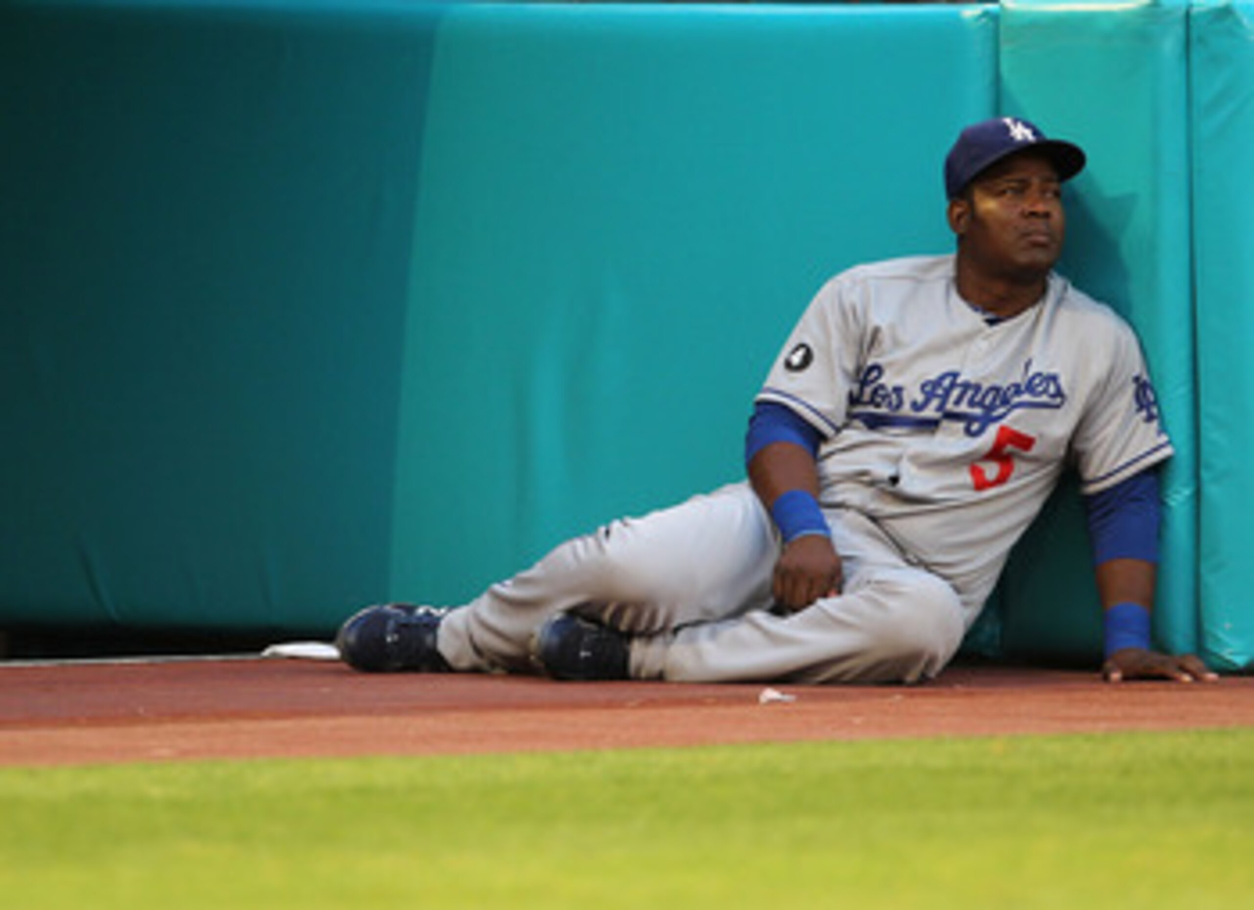 MIAMI GARDENS, FL - APRIL 26: Juan Uribe #5 of the Los Angeles Dodgers looks on during a game against the Florida Marlins at Sun Life Stadium on April 26, 2011 in Miami Gardens, Florida.  (Photo by Mike Ehrmann/Getty Images)