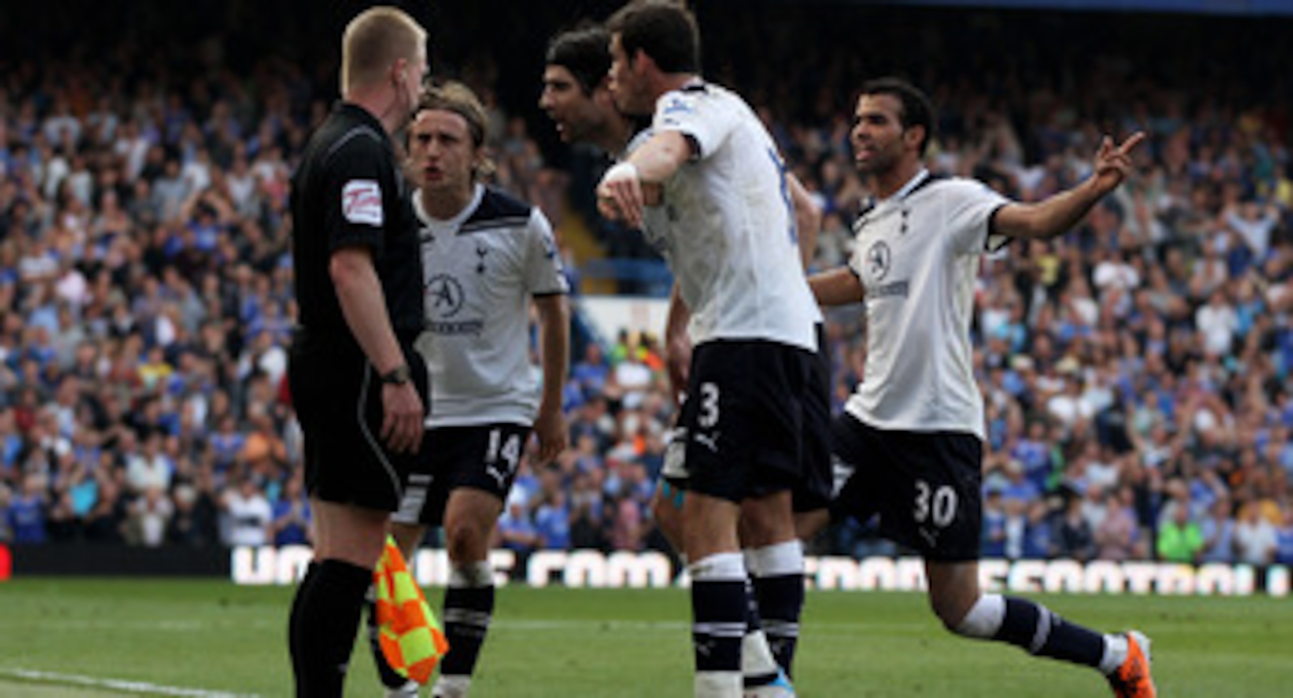 LONDON, ENGLAND - APRIL 30: Tottenham players surround the lines man after a chelsea goal is controvertially awarded to Frank Lampard of Chelsea during the Barclays Premier League match between Chelsea and Tottenham Hotspur at Stamford Bridge on April 30 LONDON, ENGLAND - APRIL 30: Tottenham players surround the lines man after a chelsea goal is controvertially awarded to Frank Lampard of Chelsea during the Barclays Premier League match between Chelsea and Tottenham Hotspur at Stamford Bridge on April 30