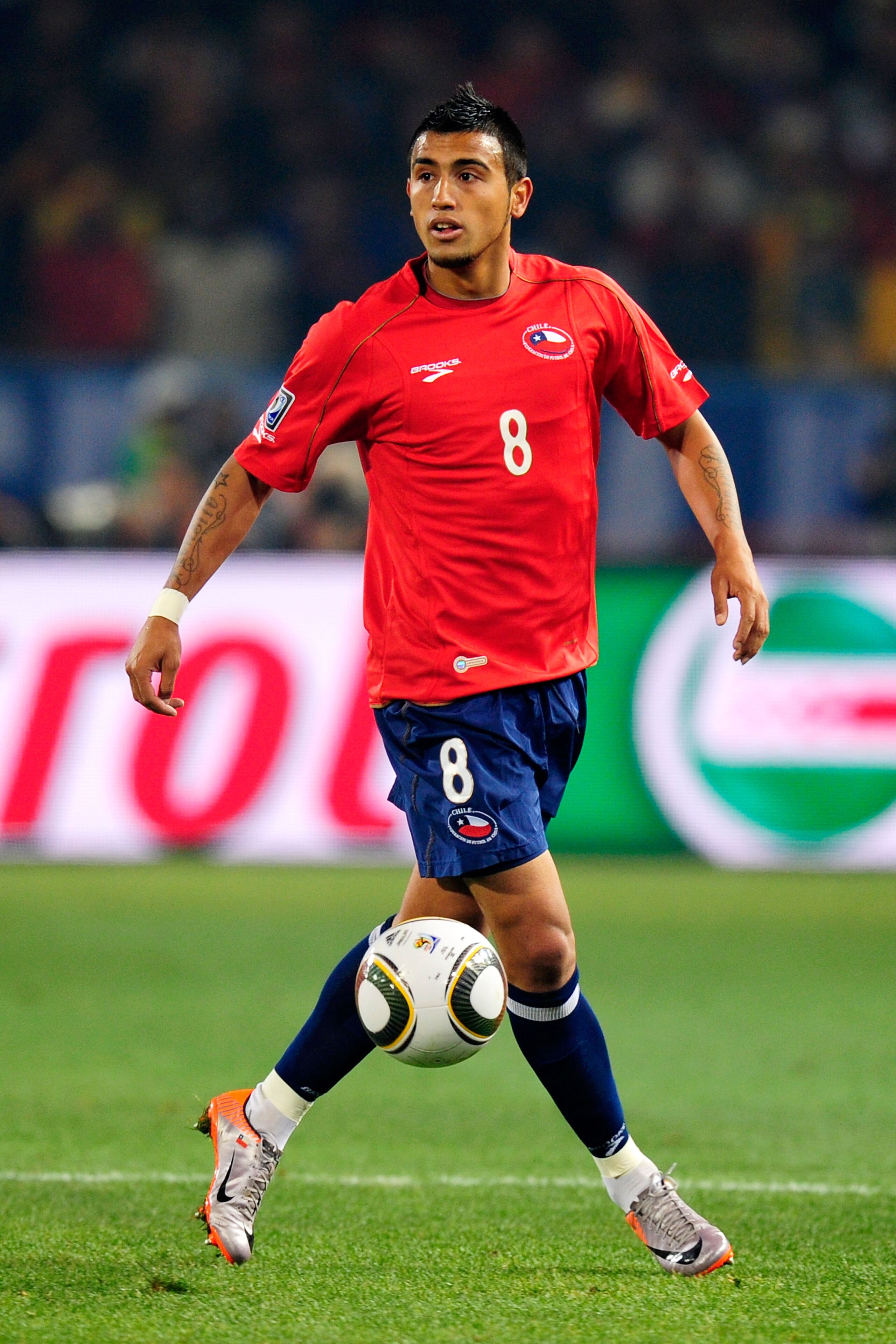 PRETORIA, SOUTH AFRICA - JUNE 25: Arturo Vidal of Chile in action during the 2010 FIFA World Cup South Africa Group H match between Chile and Spain at Loftus Versfeld Stadium on June 25, 2010 in Tshwane/Pretoria, South Africa. (Photo by Stuart Franklin/G PRETORIA, SOUTH AFRICA - JUNE 25: Arturo Vidal of Chile in action during the 2010 FIFA World Cup South Africa Group H match between Chile and Spain at Loftus Versfeld Stadium on June 25, 2010 in Tshwane/Pretoria, South Africa. (Photo by Stuart Franklin/G