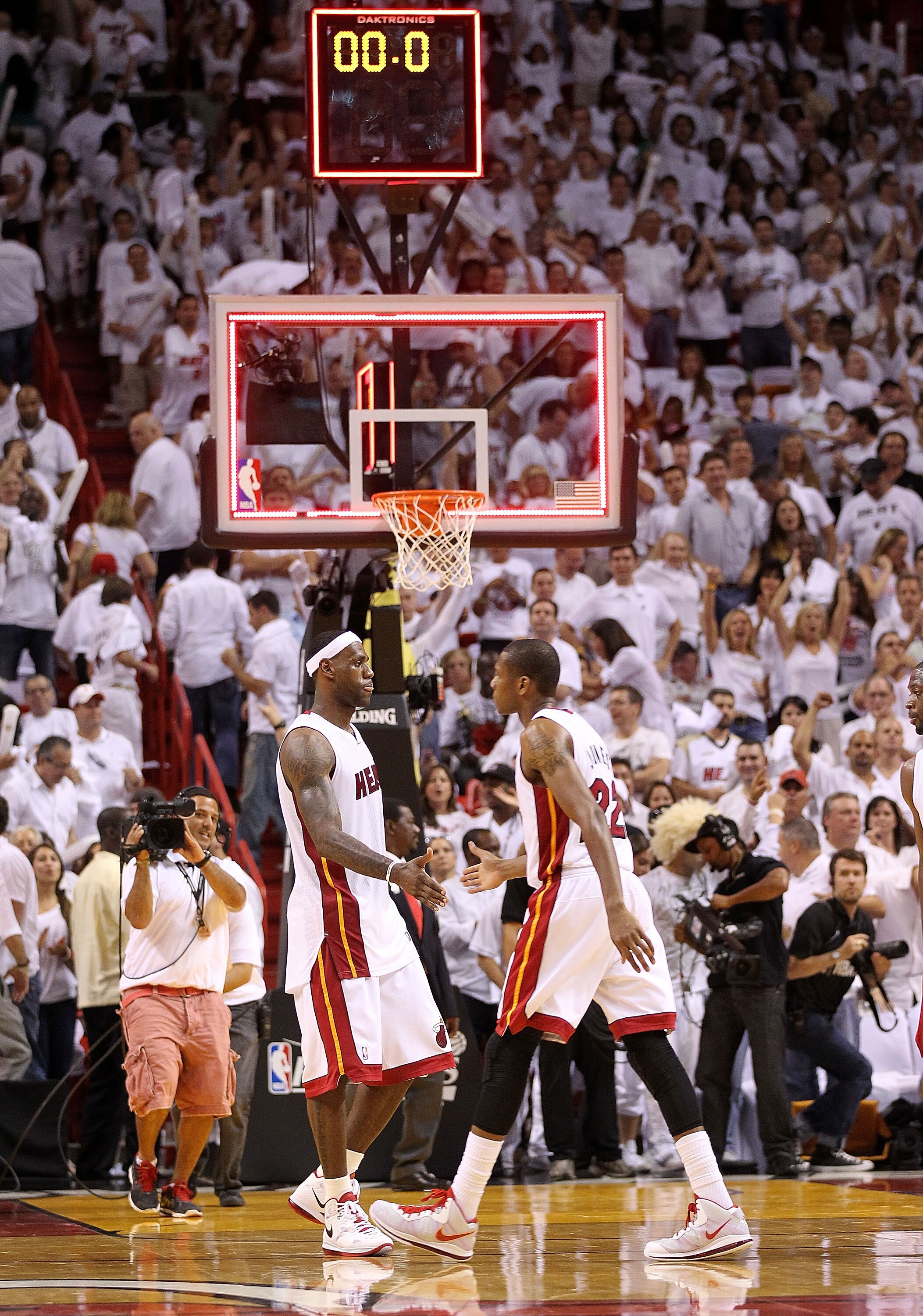 MIAMI, FL - MAY 01: LeBron James #6 and James Jones #22 of the Miami Heat shake hands after winning Game One of the Eastern Conference Semifinals of the 2011 NBA Playoffs against the Boston Celtics at American Airlines Arena on May 1, 2011 in Miami, Flori