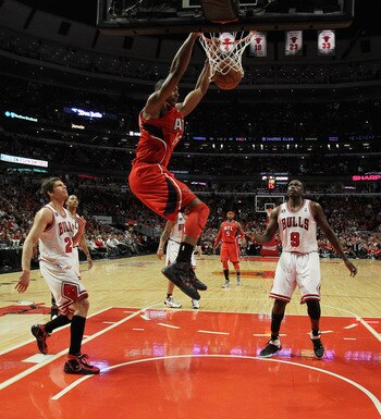 CHICAGO, IL - MAY 02: Al Horford #15 of the Atlanta Hawks dunks the ball over Kyle Korver #26 and Loul Deng #9 of the Chicago Bulls in Game One of the Eastern Conference Semifinals in the 2011 NBA Playoffs at the United Center on May 2, 2011 in Chicago, I