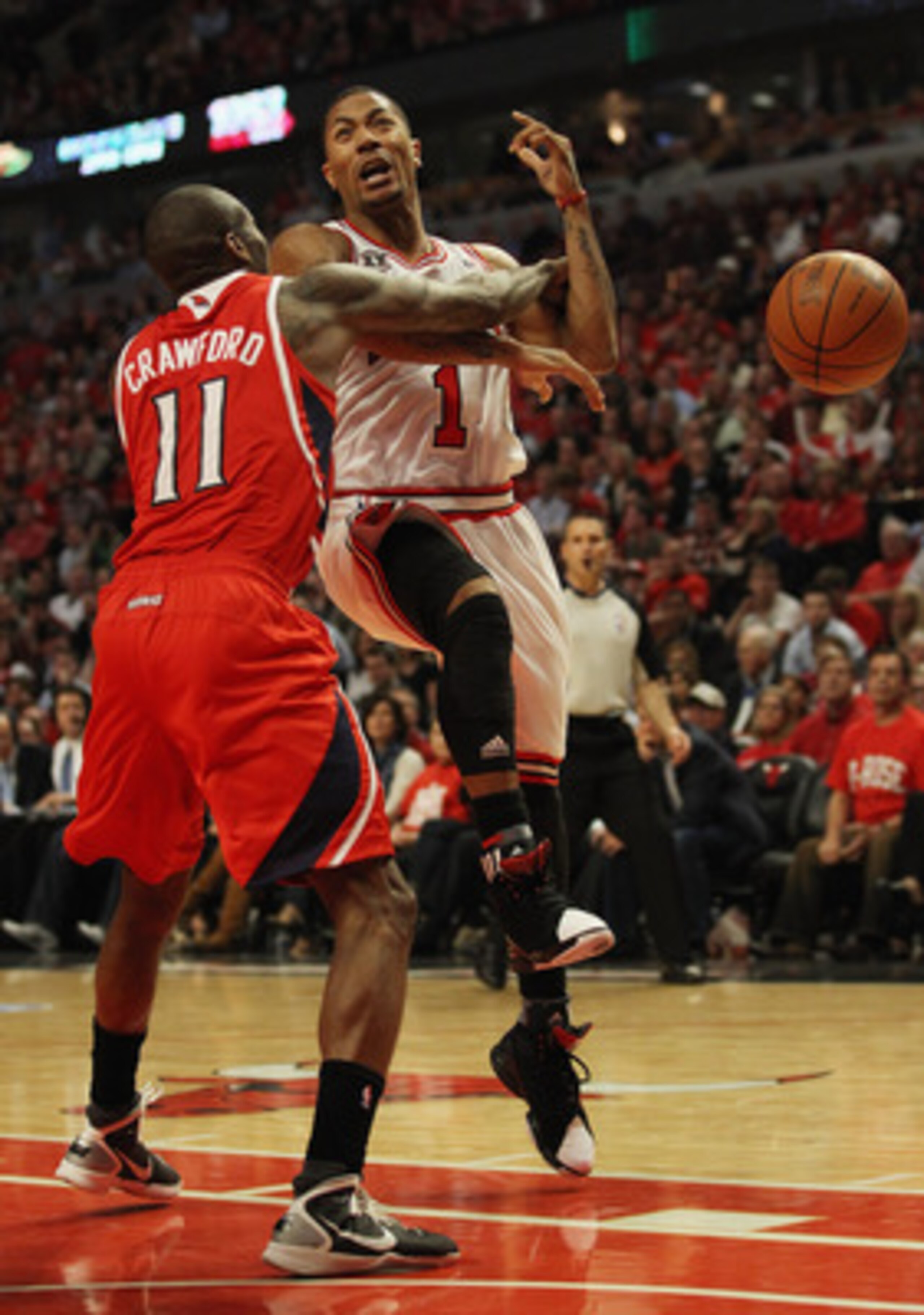 CHICAGO, IL - MAY 02: Derrick Rose #1 of the Chicago Bulls is hit by Jamal Crawford #11 of the Atlanta Hawks as he tries to shoot in Game One of the Eastern Conference Semifinals in the 2011 NBA Playoffs at the United Center on May 2, 2011 in Chicago, Ill