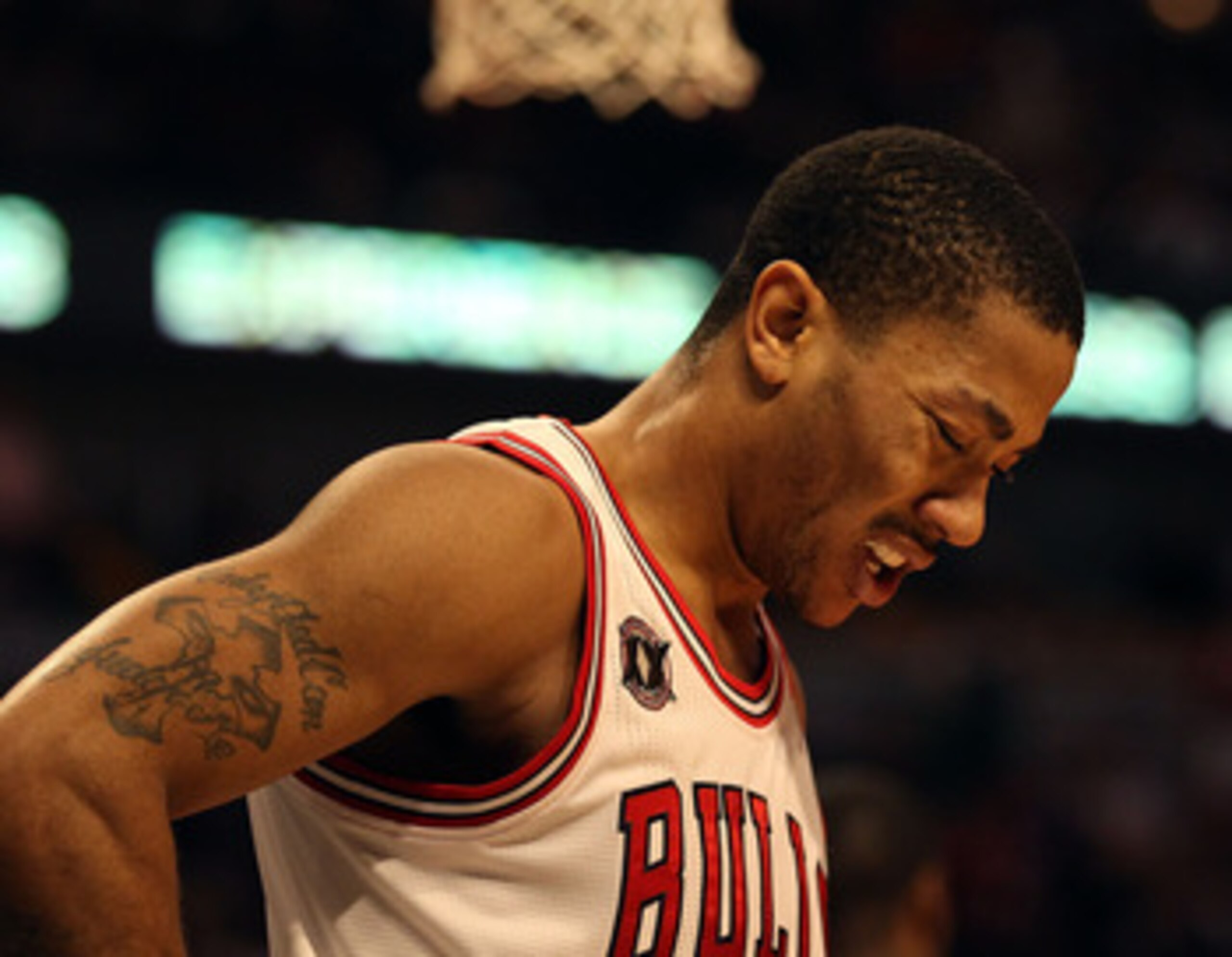 CHICAGO, IL - JANUARY 28: Derrick Rose #1 of the Chicago Bulls, playing in pain from an ulcer, reacts as walks to the free-throw line against the Orlando Magic at the United Center on January 28, 2011 in Chicago, Illinois. The Bulls defeated the Magic 99-