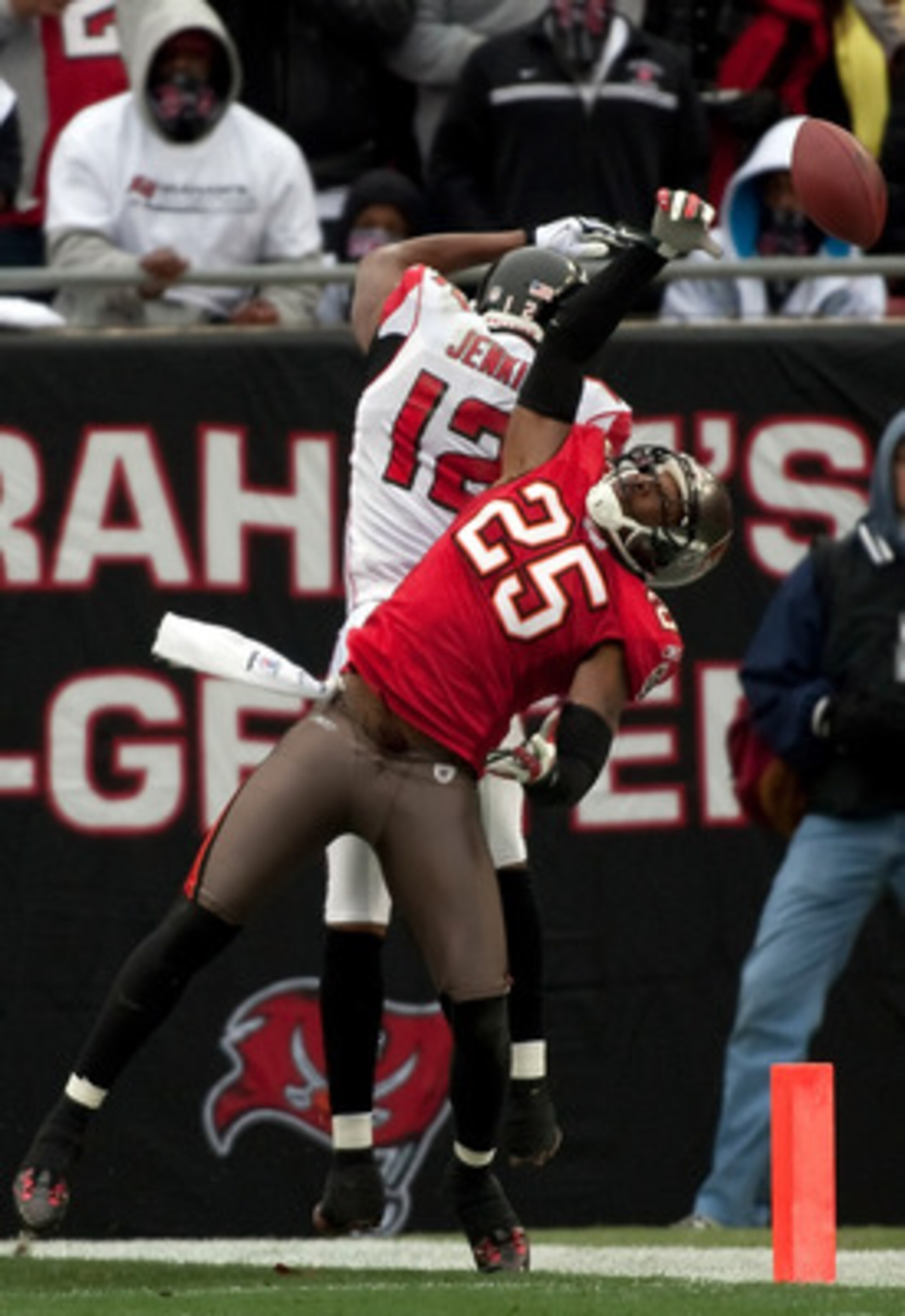 TAMPA, FL - JANUARY 03:  Defensive back Aqib Talib #25 of the Tampa Bay Buccaneers breaks up a pass intended for receiver Michael Jenkins #12 of the Atlanta Falcons during the game at Raymond James Stadium on January 3, 2010 in Tampa, Florida.  (Photo by