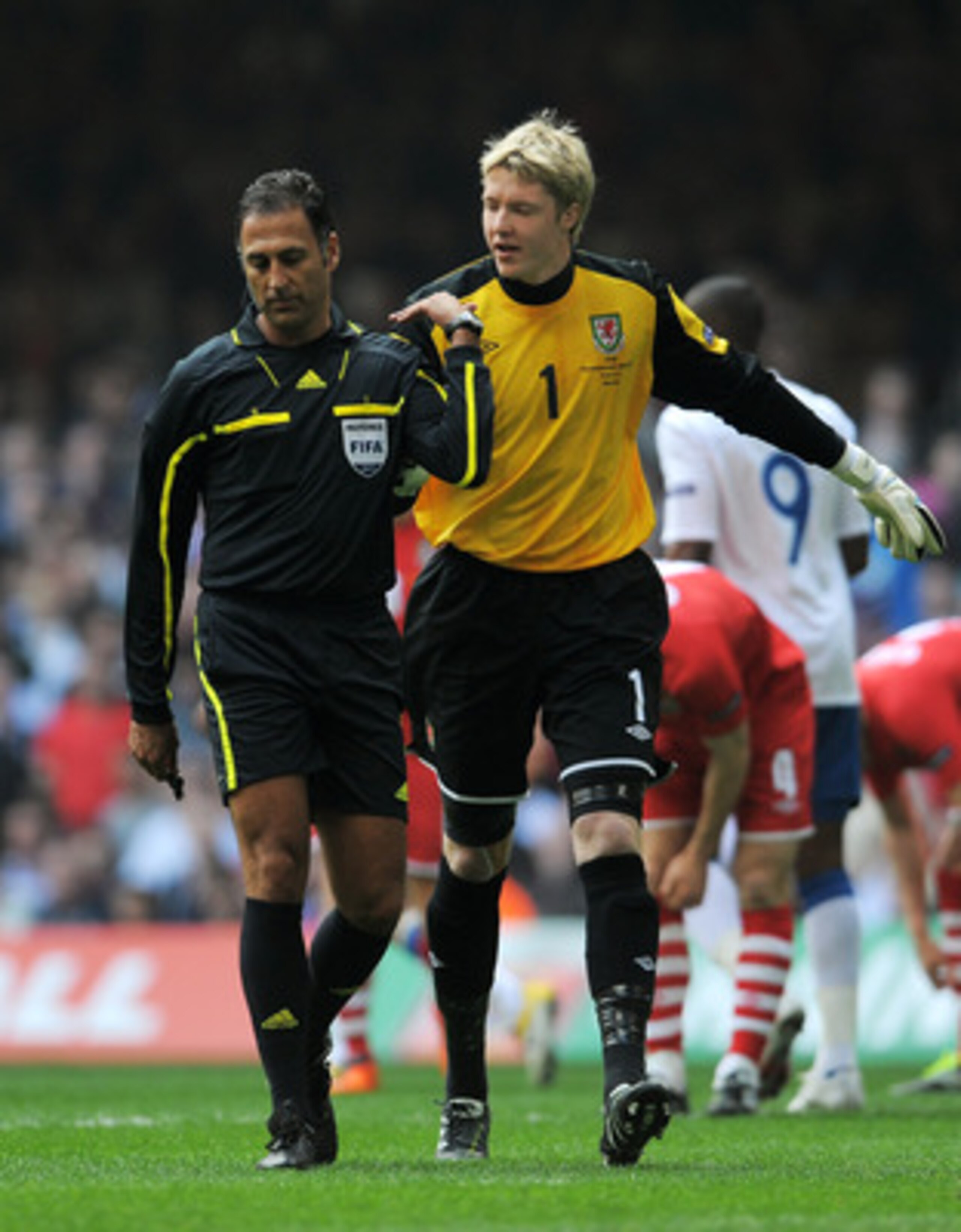 CARDIFF, WALES - MARCH 26:  Goalkeeper Wayne Hennessey of Wales appeals to Referee Olegario Benquerenca of Portugal after awarding a penalty to England during the UEFA EURO 2012 Group G qualifying match between Wales and England at the Millennium Stadium 