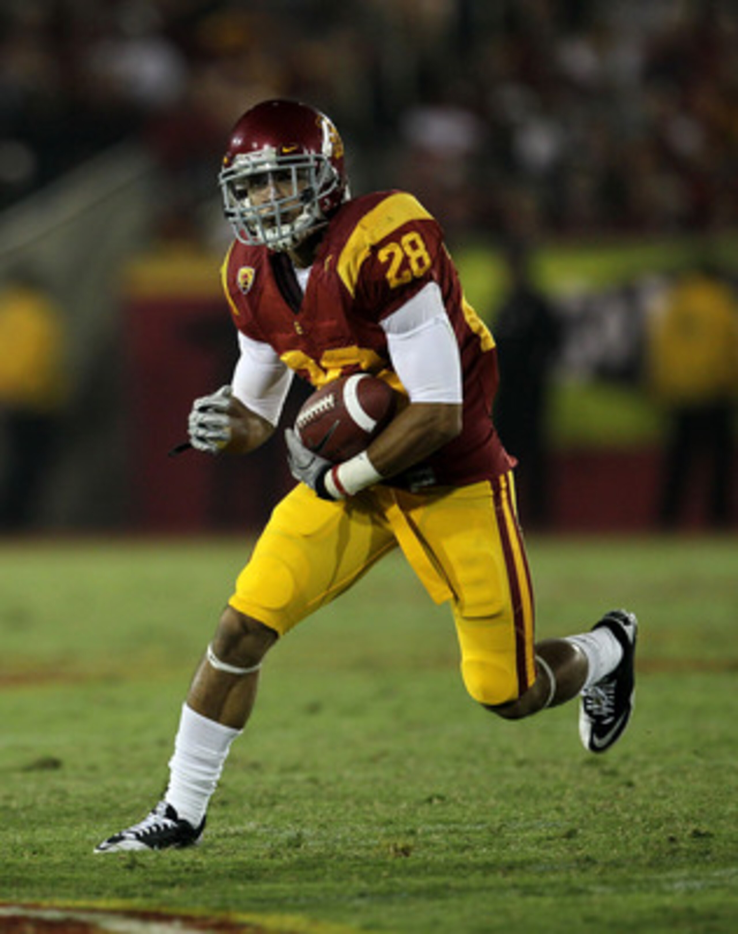 LOS ANGELES, CA - SEPTEMBER 11:  Running back Dillon Baxter #28 of the USC Trojans carries the ball against the Virginia Cavaliers at Los Angeles Memorial Coliseum on September 11, 2010 in Los Angeles, California. USC won 17-14.  (Photo by Stephen Dunn/Ge