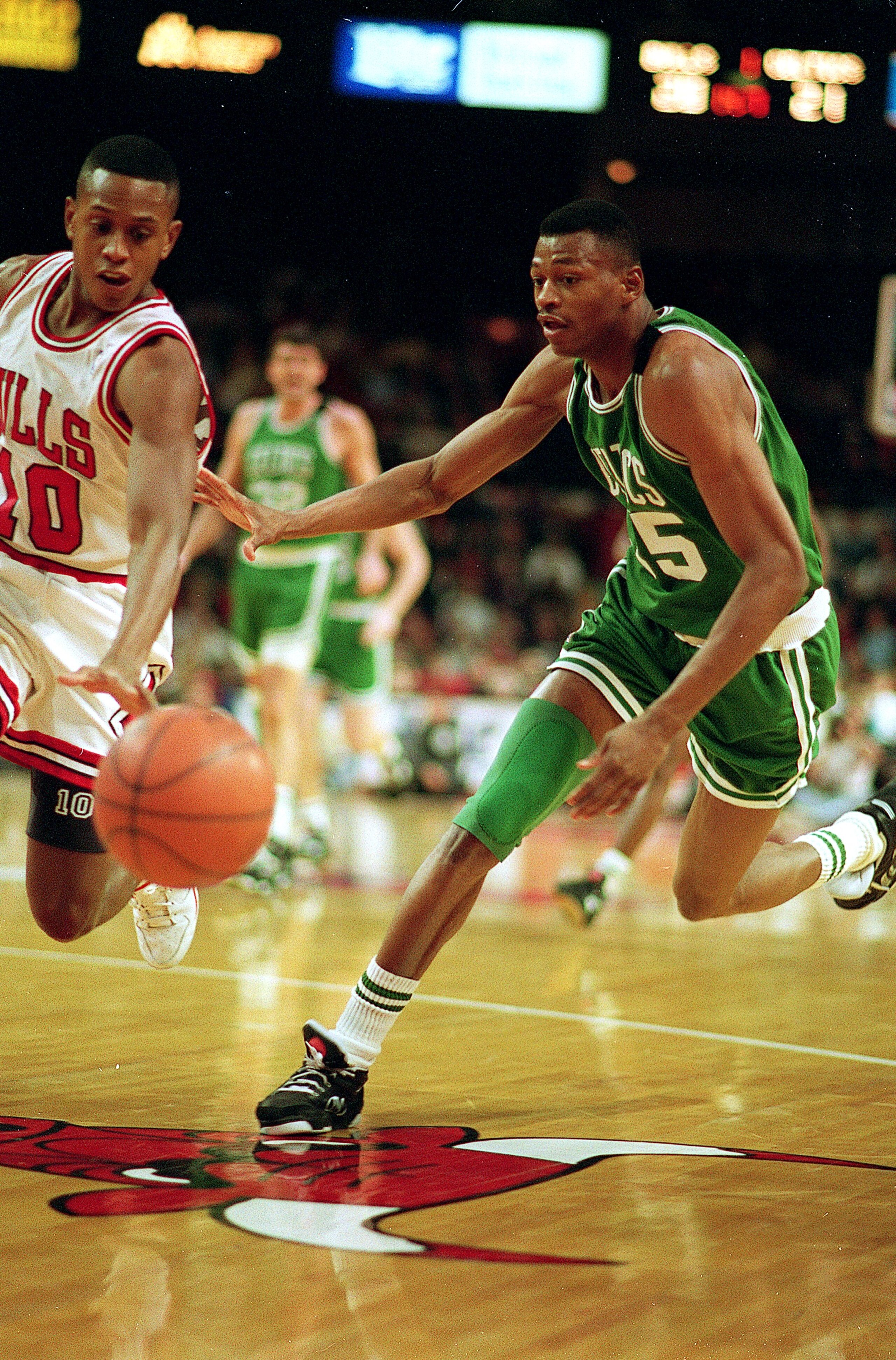 CHICAGO - 1993:  Reggie Lewis of the Boston Celtics dribbles the ball during the 1993 NBA game against the Chicago Bulls at the United Center in Chicago, Illinois. NOTE TO USER: User expressly acknowledges and agrees that, by downloading and/or using this